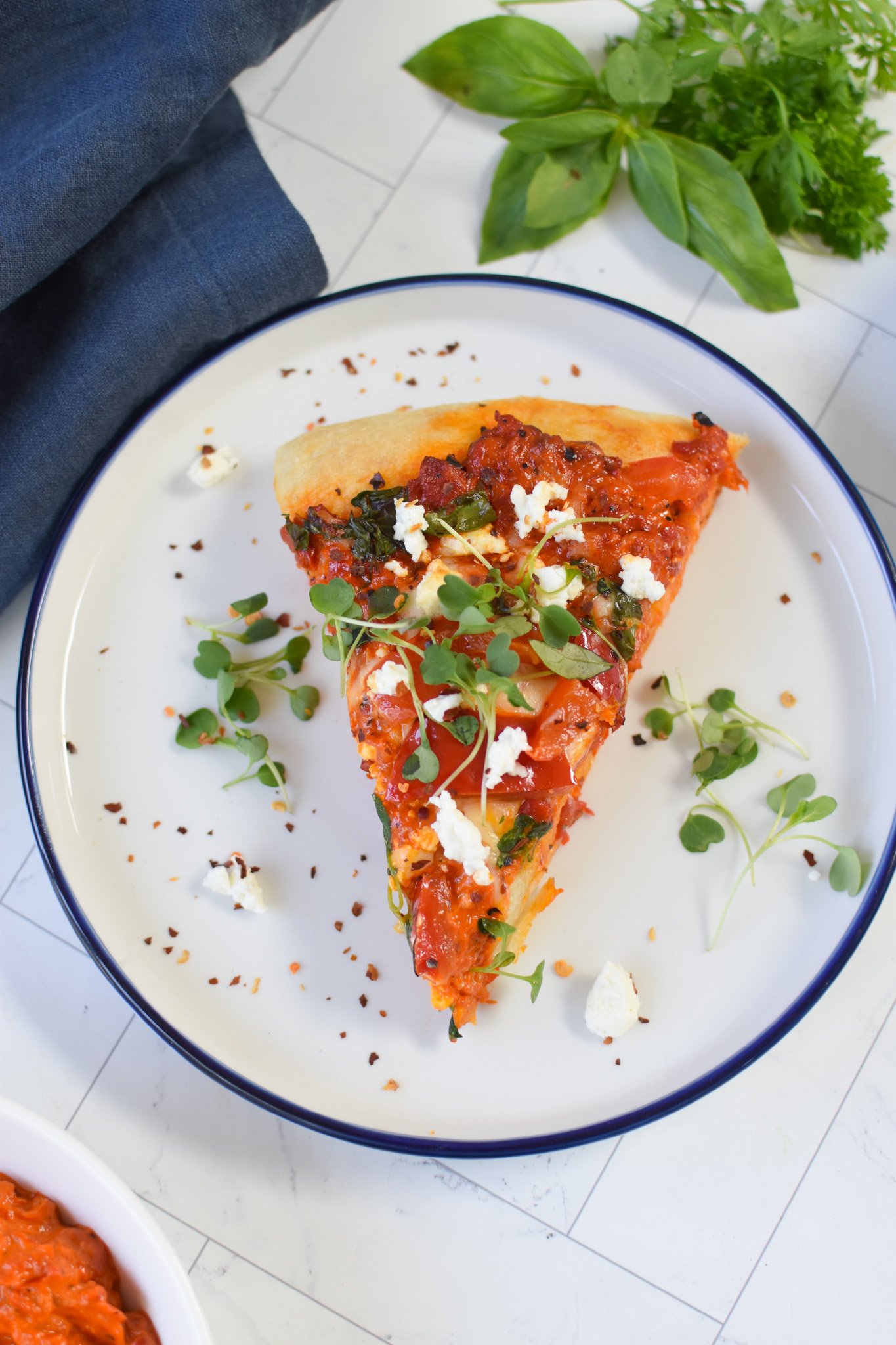 Cast Iron Mediterranean Pizza on a white plate. 