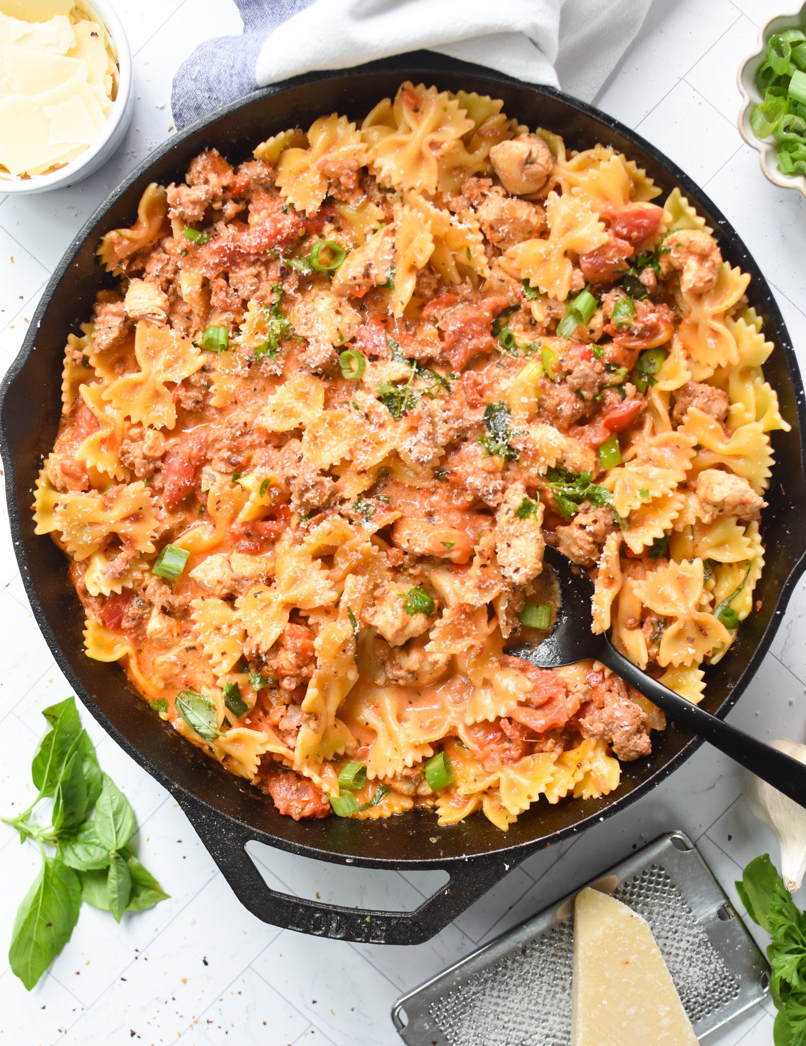 Creamy Chicken and Chorizo Pasta Recipe in a cast iron skillet.