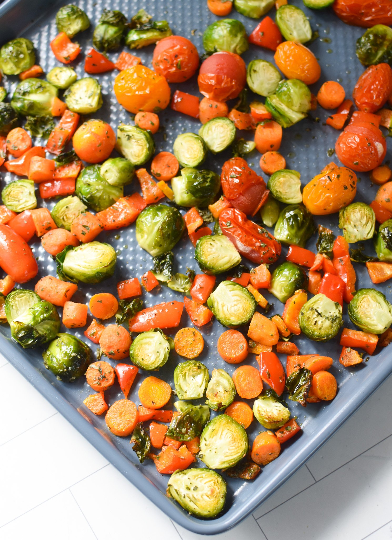 Roasted Vegetable Goat Cheese Flatbread Pizza Recipe on a baking sheet.