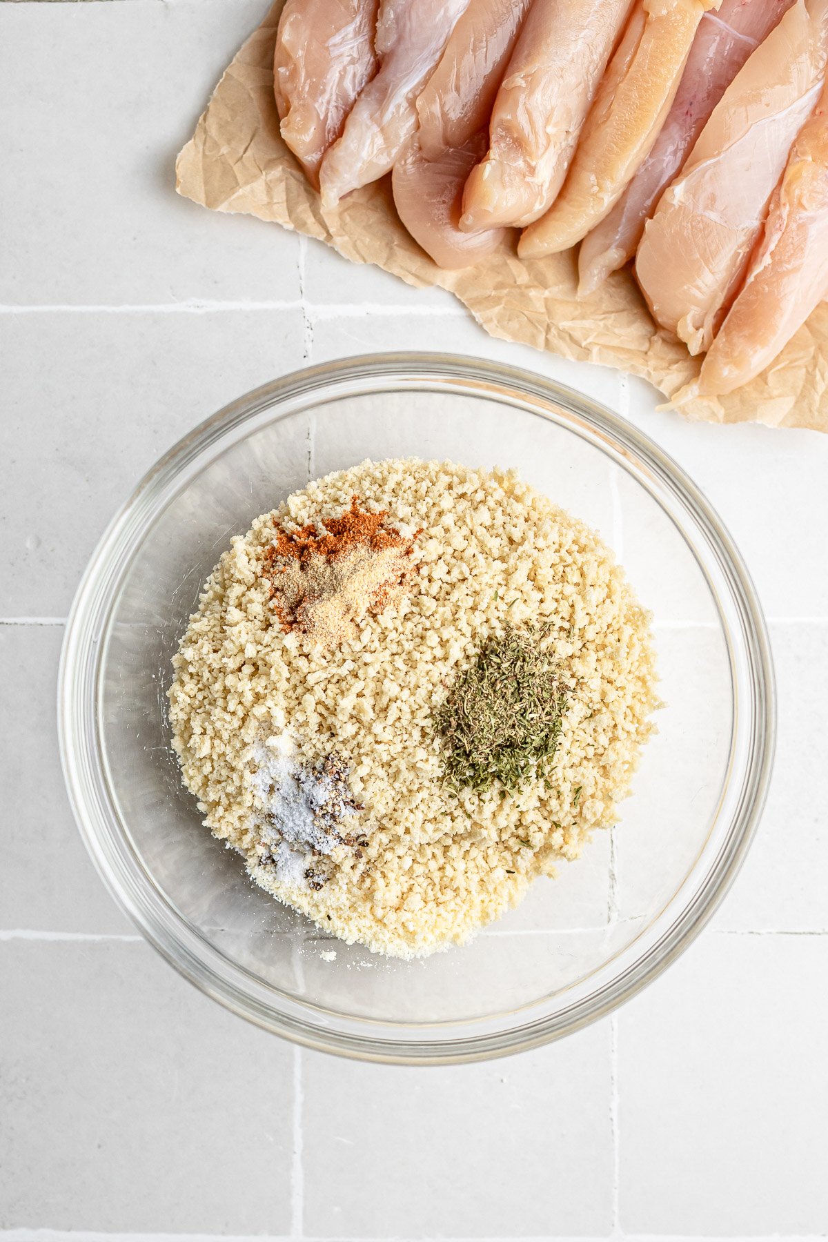Mixing panko, Parmesan, and spices for chicken tenders
