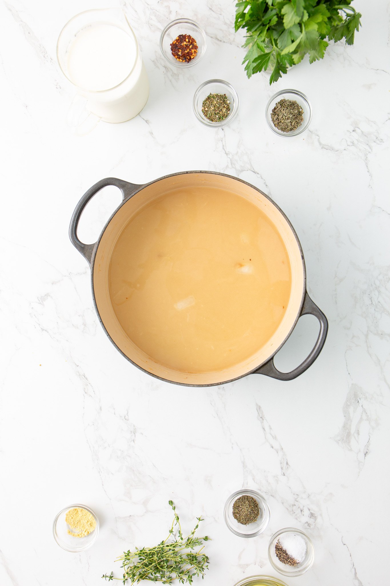 Copycat Olive Garden Chicken Gnocchi Soup Recipe broth in pot. 