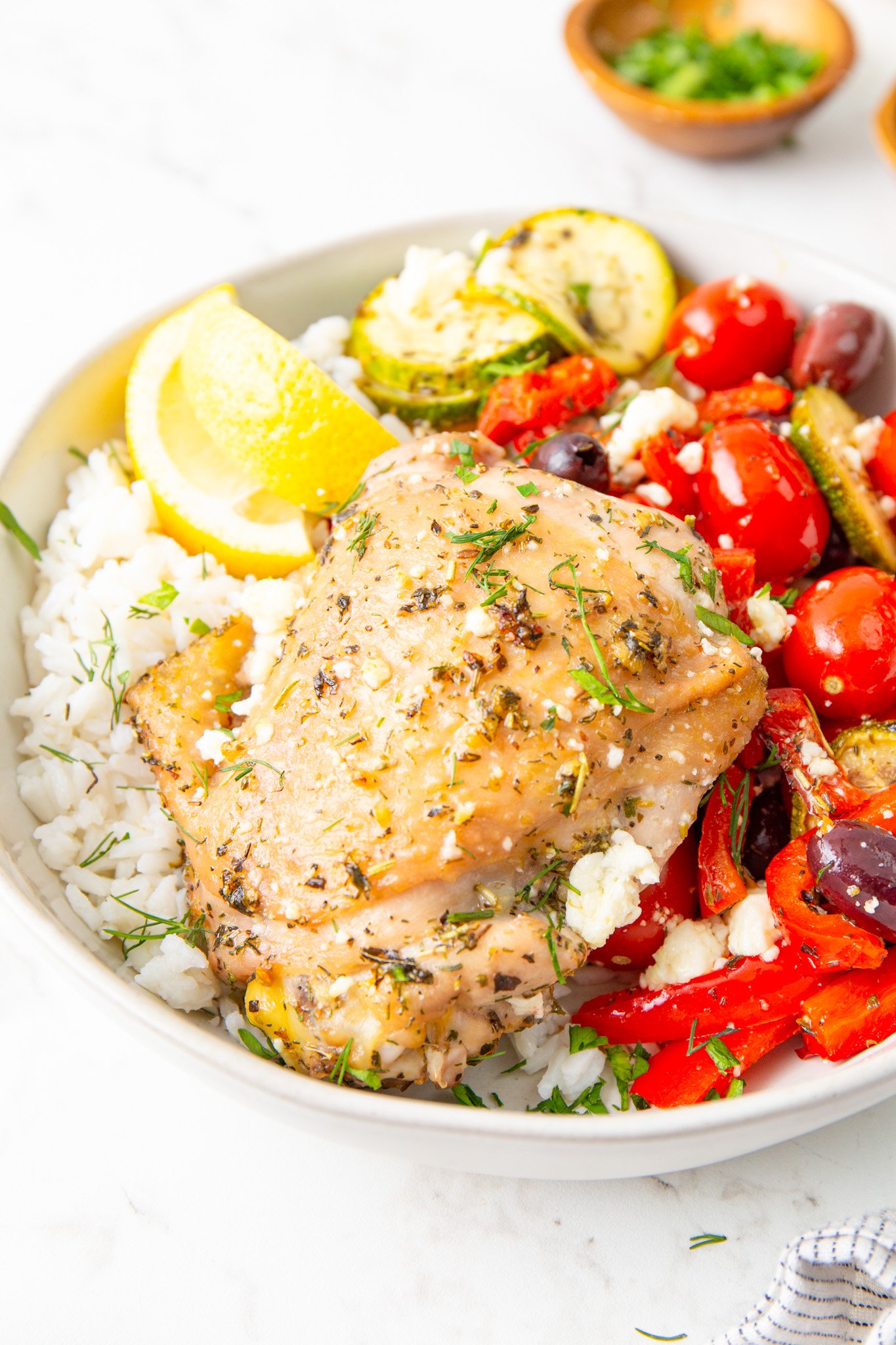 Mediterranean Sheet Pan Chicken in a bowl. 