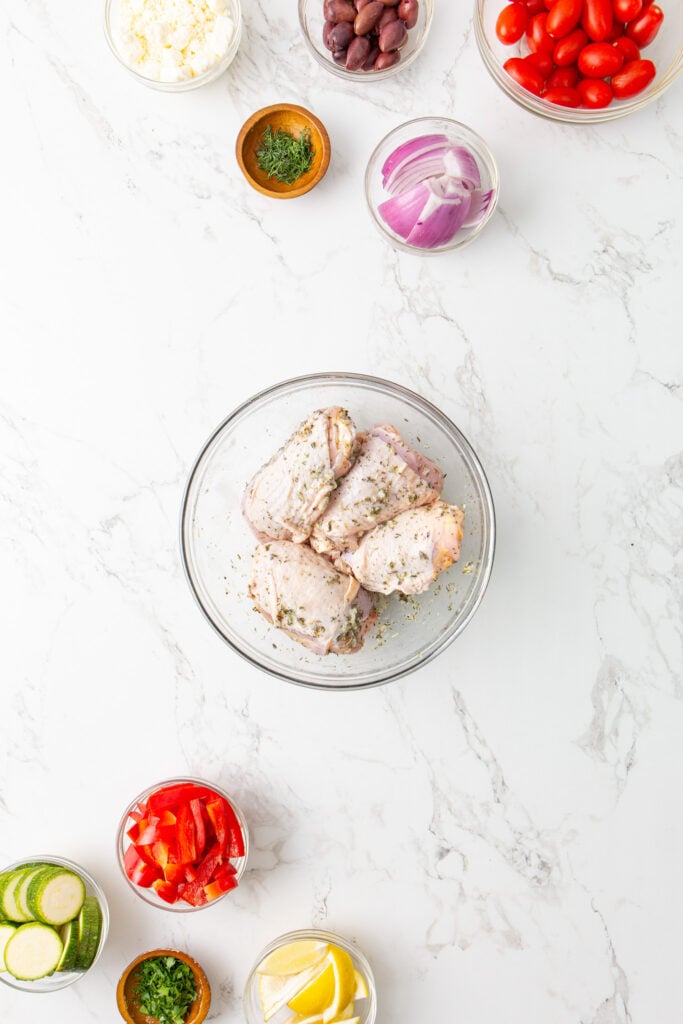 Mediterranean Sheet Pan Chicken in a marinade.