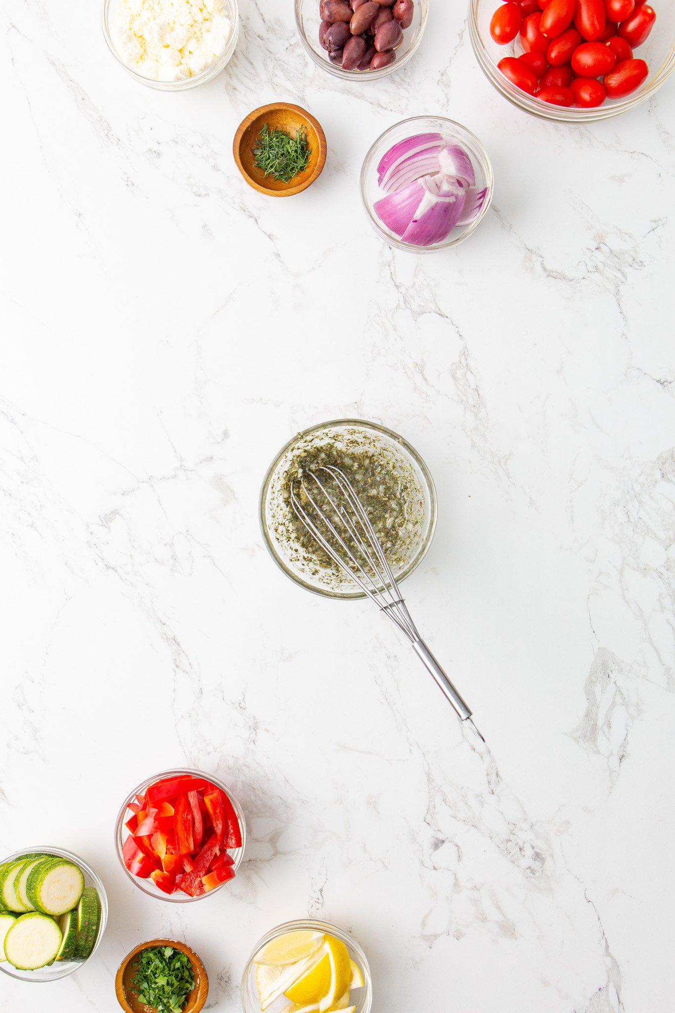 Mediterranean Sheet Pan Chicken marinade in bowl. 