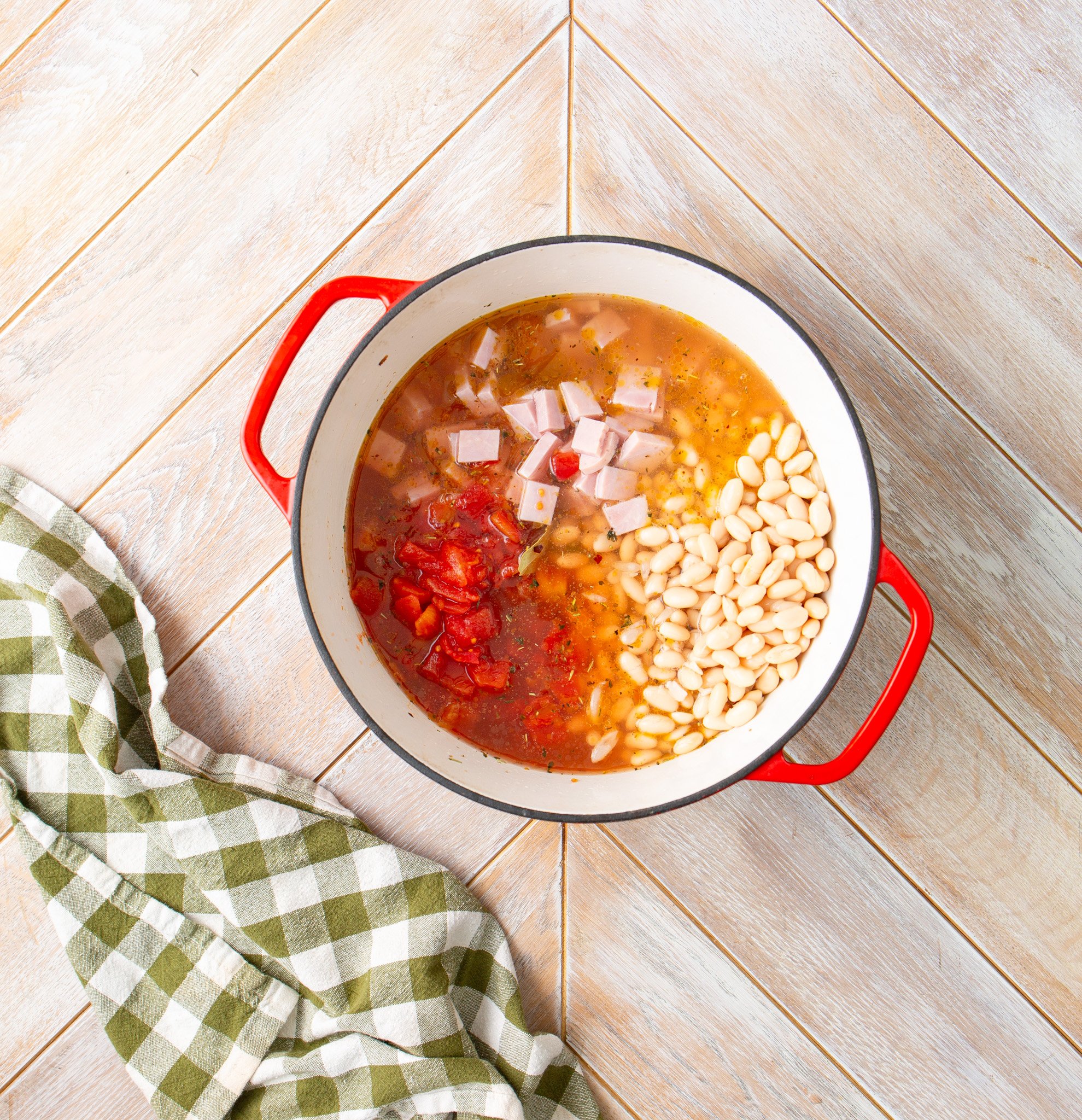 Navy Bean Soup Recipe tomatoes and ham in the pot