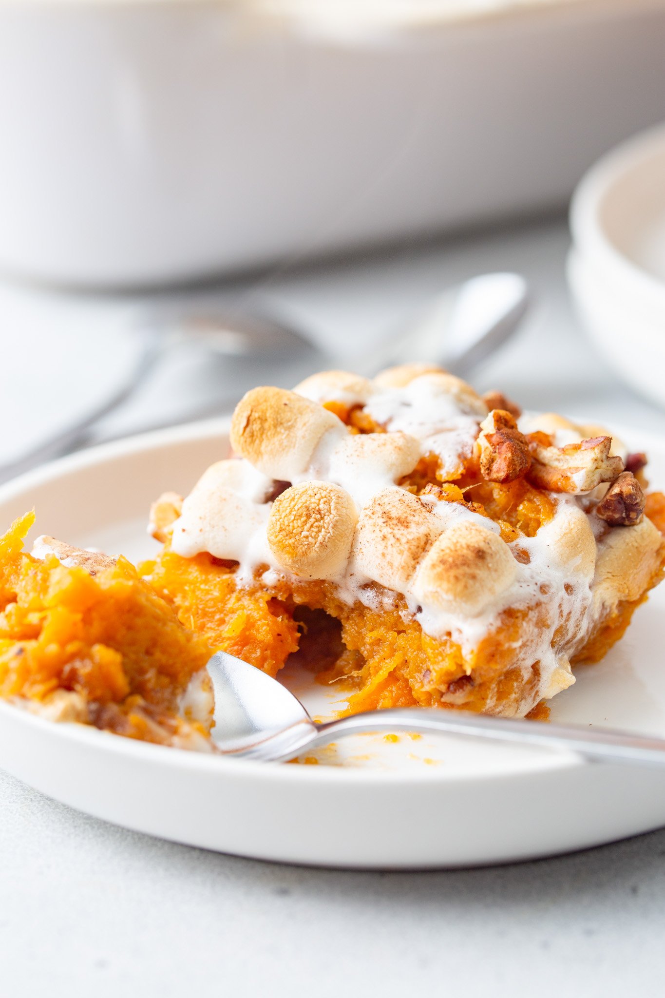 Sweet Potato Casserole with Marshmallows with a spoon