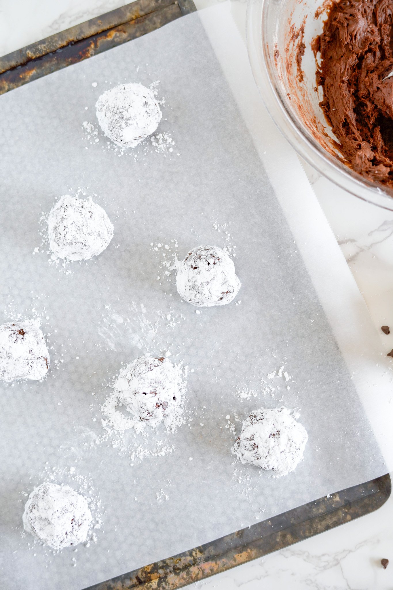 Chocolate Crinkle Cookie Recipe on a baking sheet. 