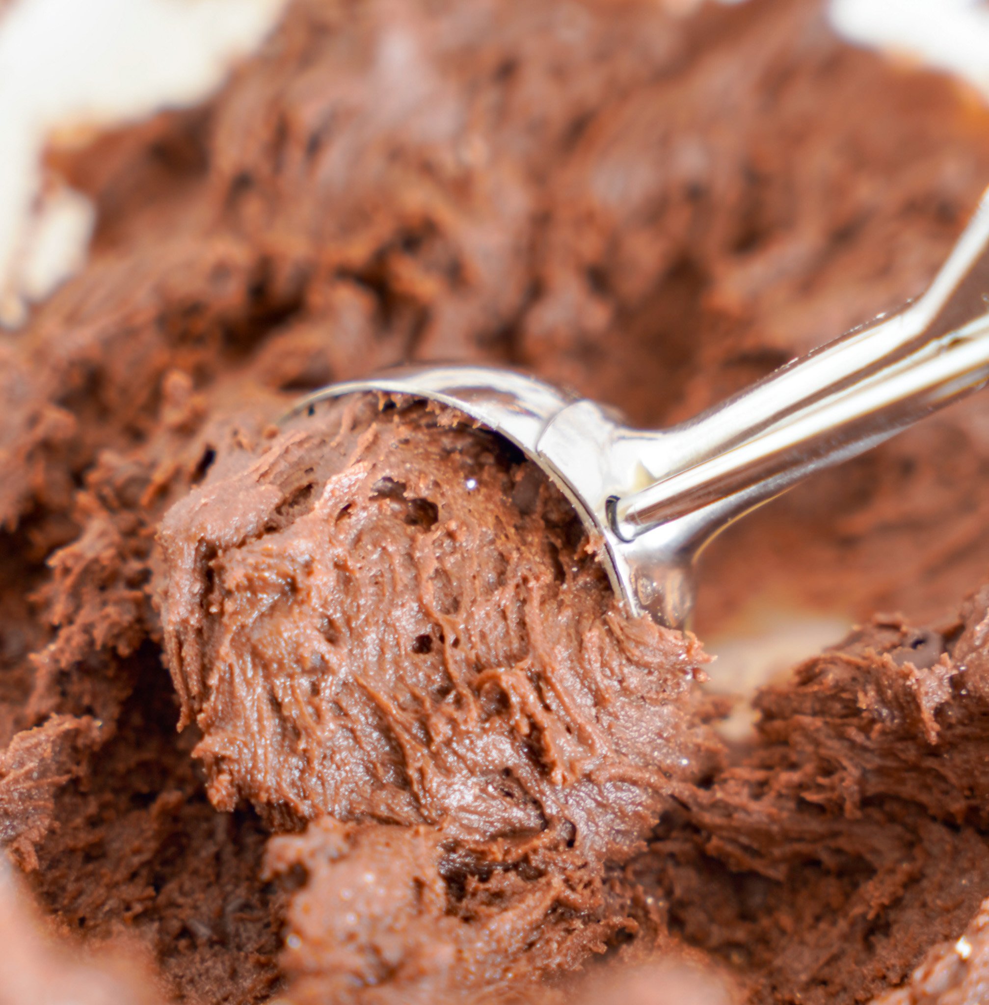 Chocolate Crinkle Cookie Recipe dough in cookie scoop. 