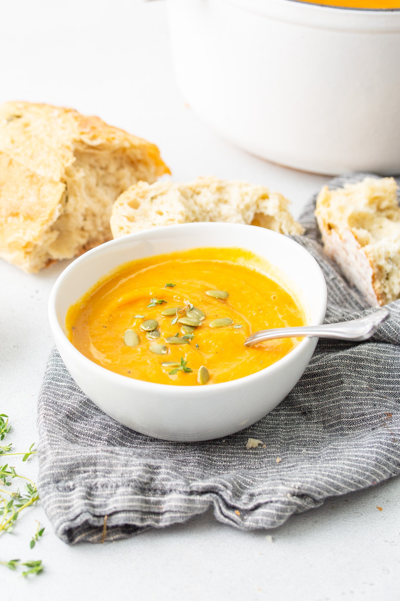 Easy Roasted Butternut Squash Soup with spoon and bread