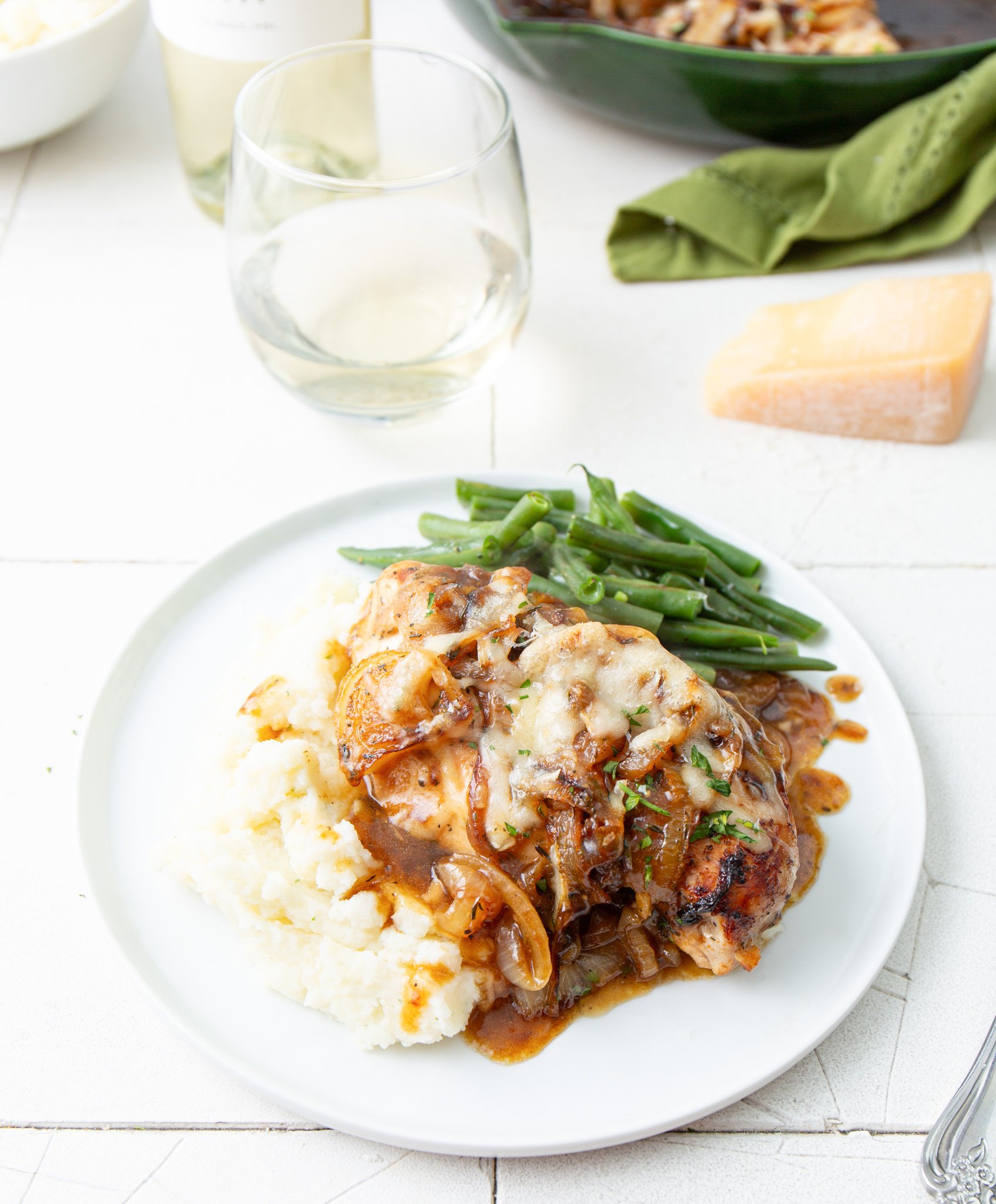 French Onion Chicken on a plate with green beans