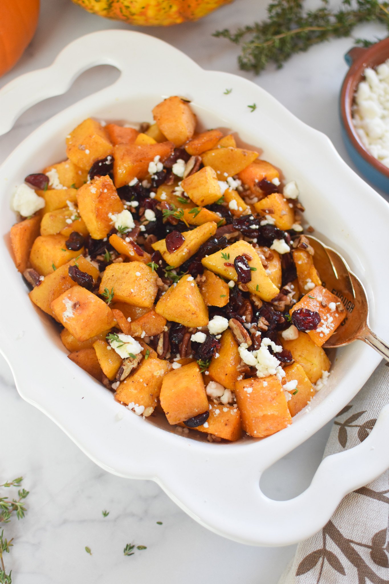 Roasted Butternut Squash with Cranberries with spoon 