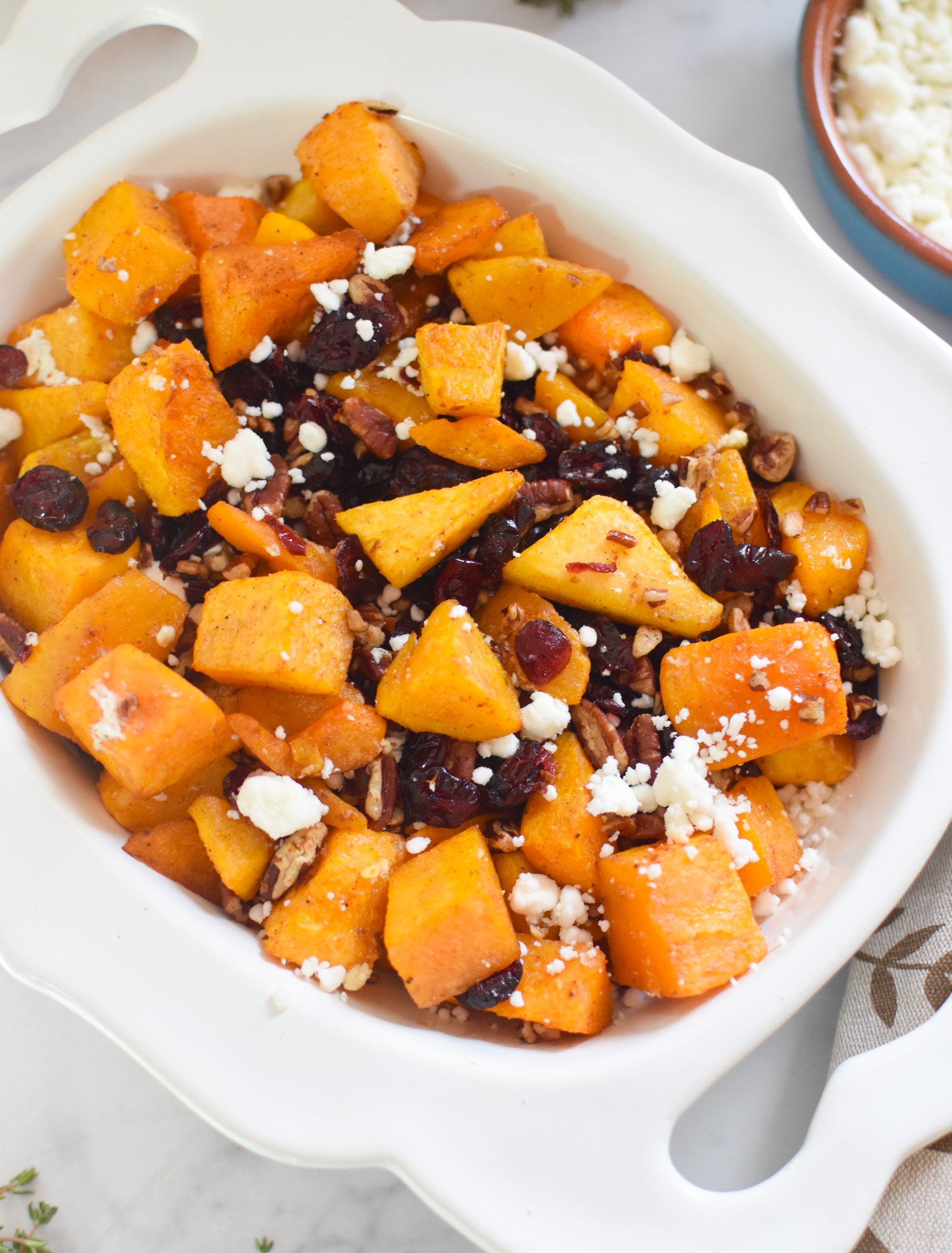 Roasted Butternut Squash with Cranberries in white bowl