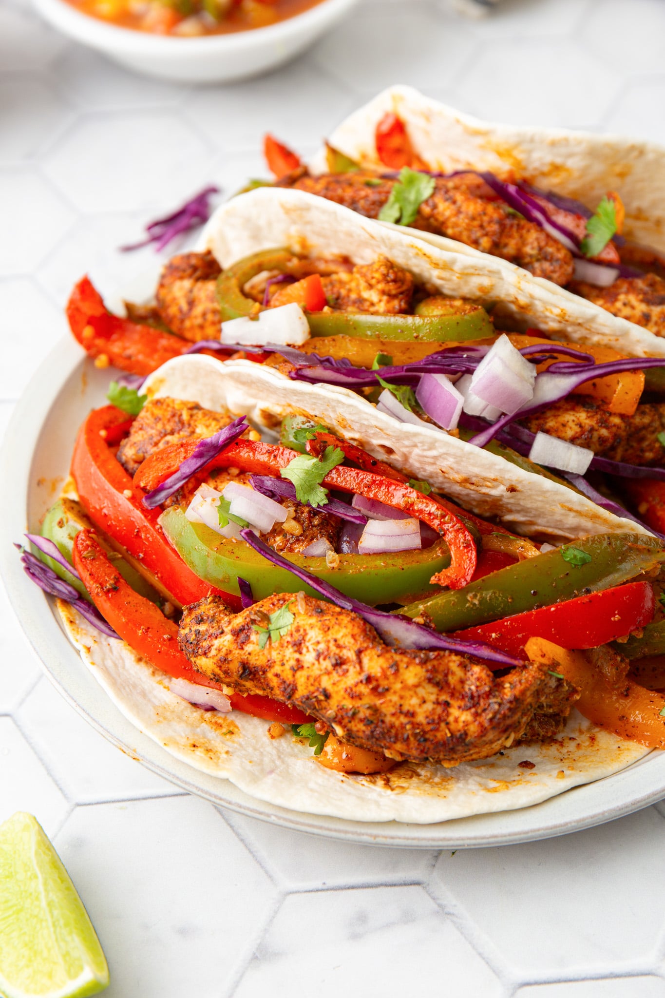 Sheet Pan Chicken Fajitas in tortillas