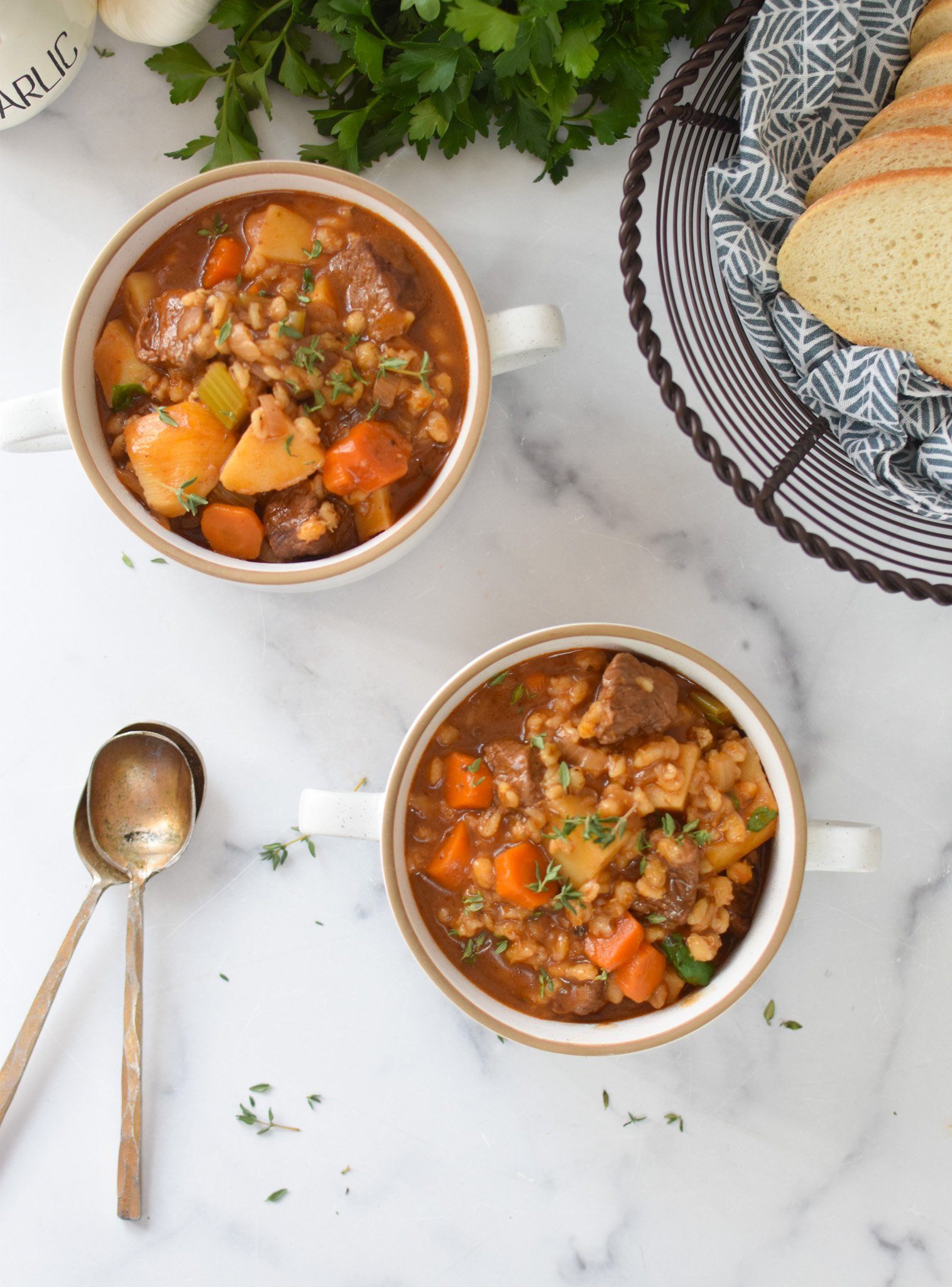 Slow Cooker Beef Barley Soup with spoons 