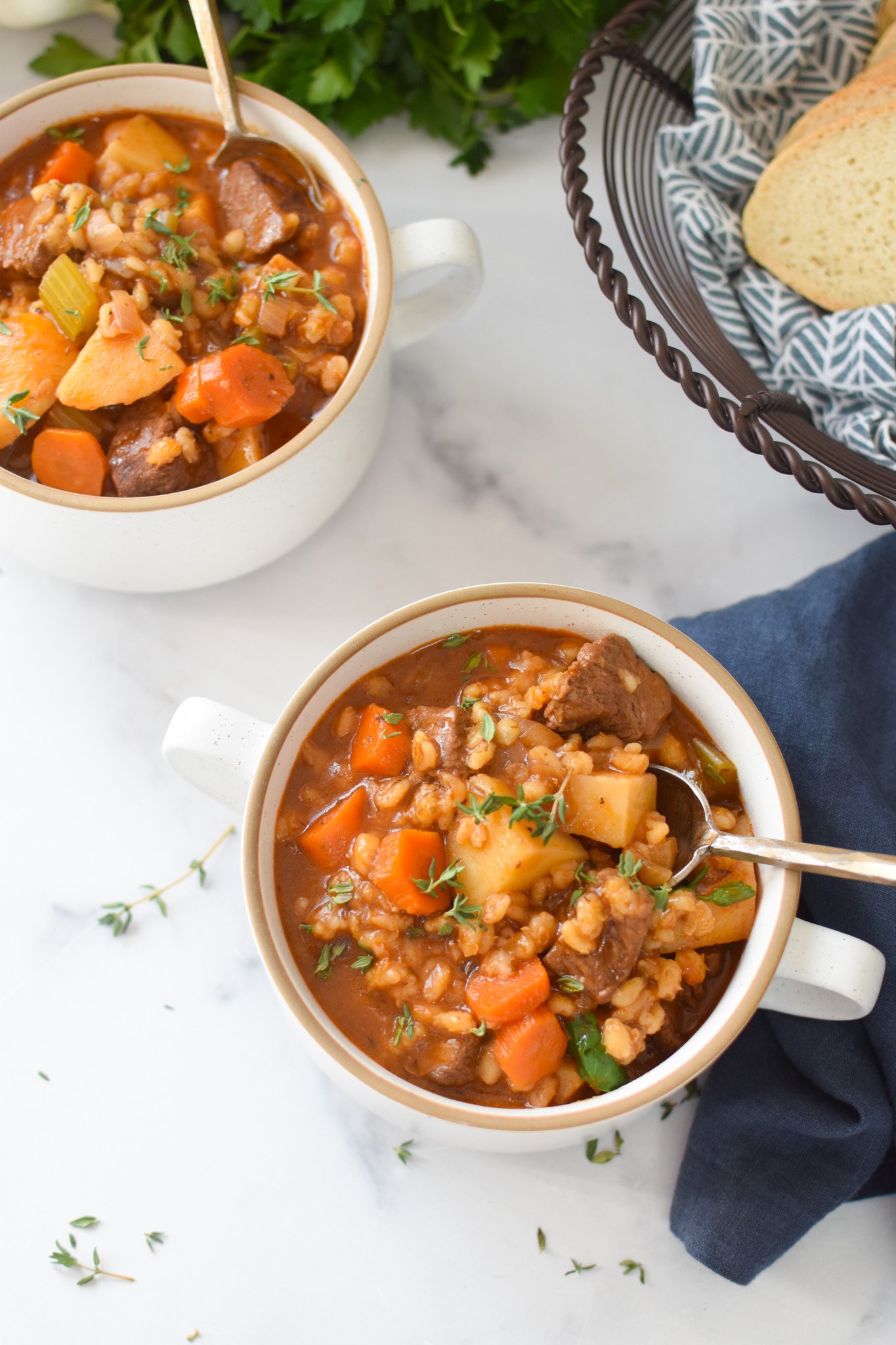 Slow Cooker Beef Barley Soup with spoon in a bowl 