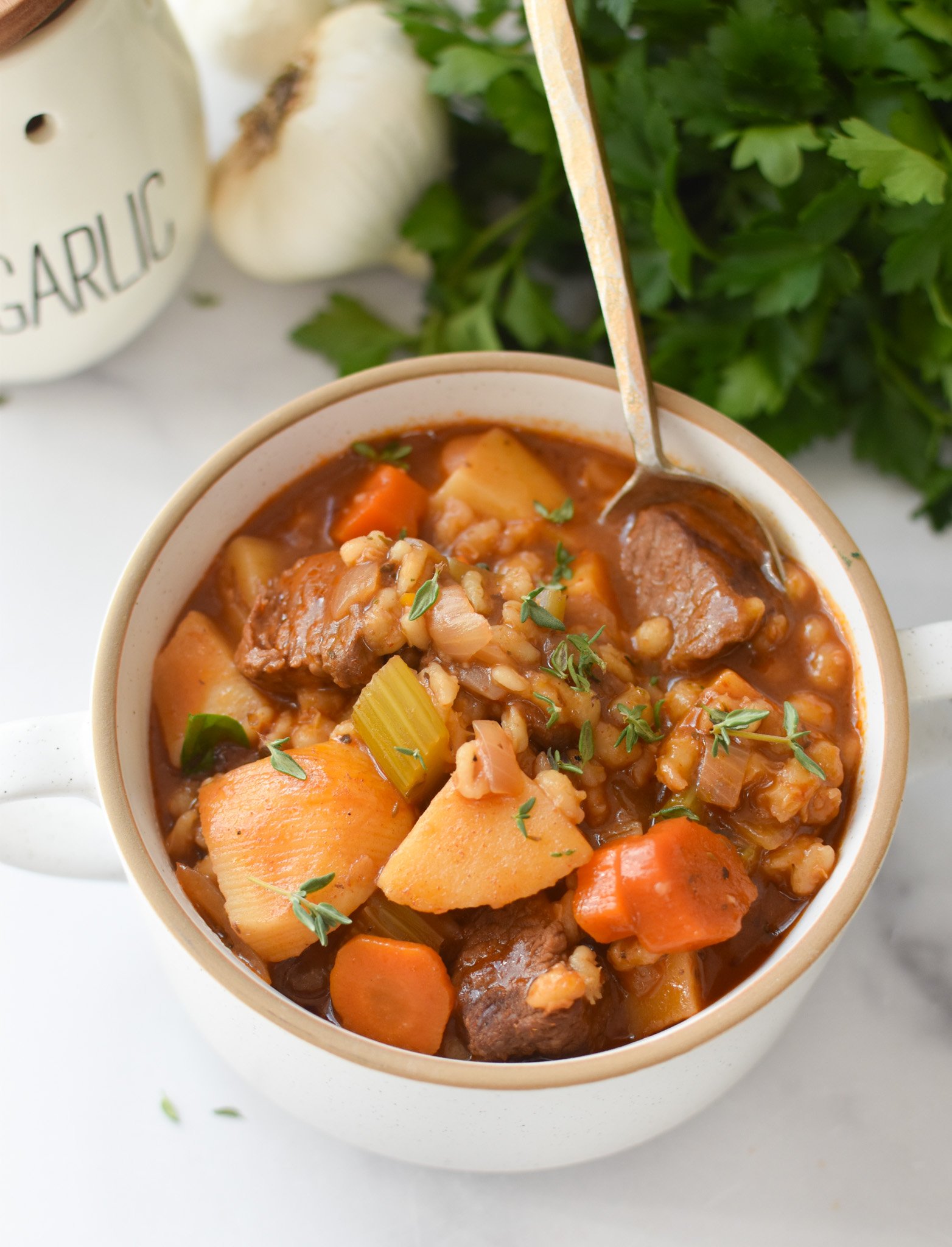 Slow Cooker Beef Barley Soup with spoon 