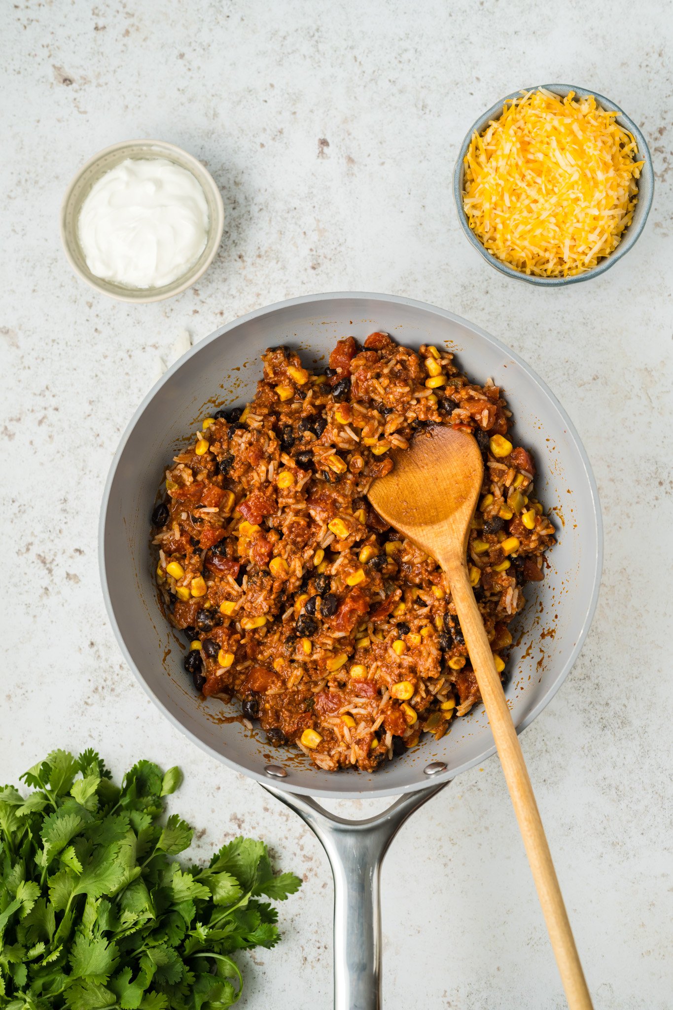 Stuffed Poblano Peppers Recipe chorizo and tomatoes in skillet.