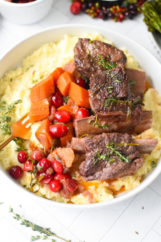 Cranberry Braised Short Ribs Recipe with fresh rosemary. 