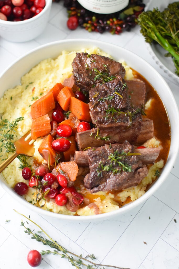 Cranberry Braised Short Ribs Recipe in a white bowl.
