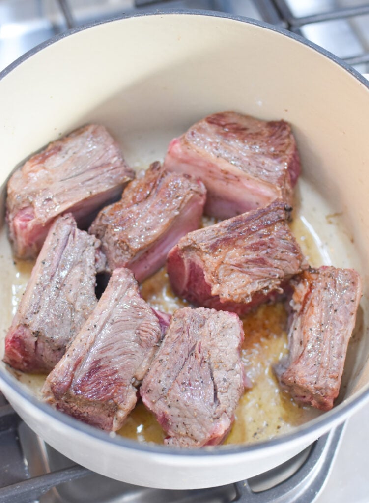 Cranberry Braised Short Ribs Recipe browning the short ribs. 