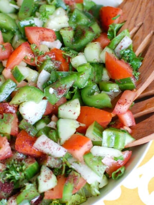Easy Lebanese Salad in white bowl with wooden spoons