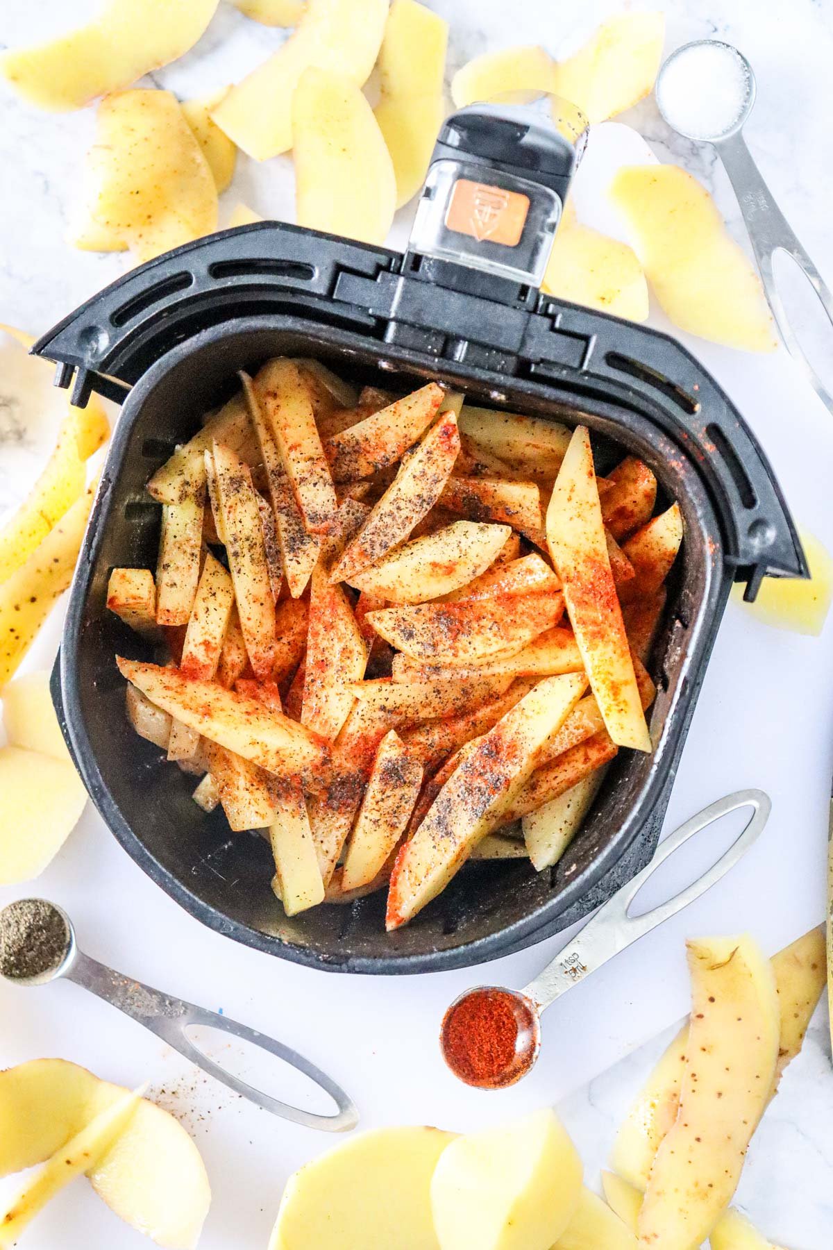 Air Fryer French Fries Recipe in an air fryer basket 