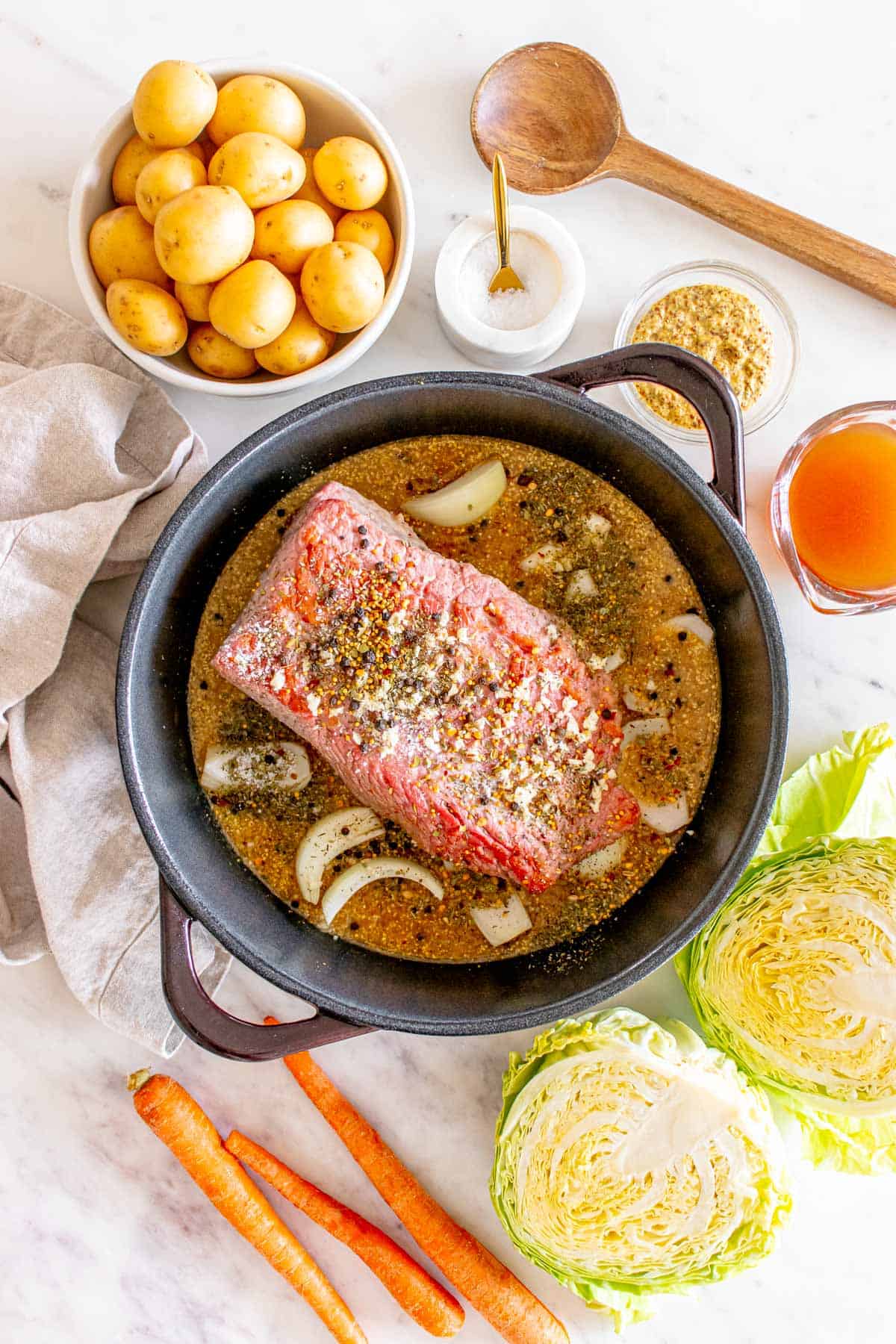 Baked Corned Beef and Cabbage with broth in pot