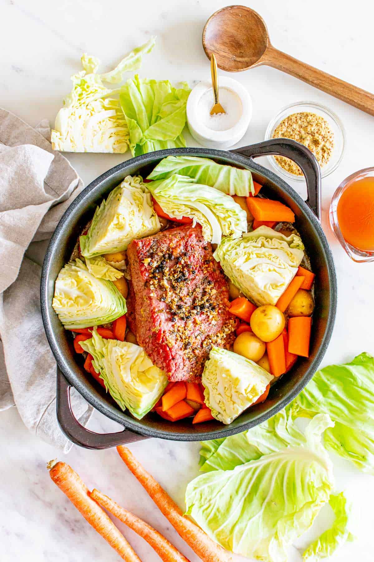 Baked Corned Beef and Cabbage with vegetables in a pot