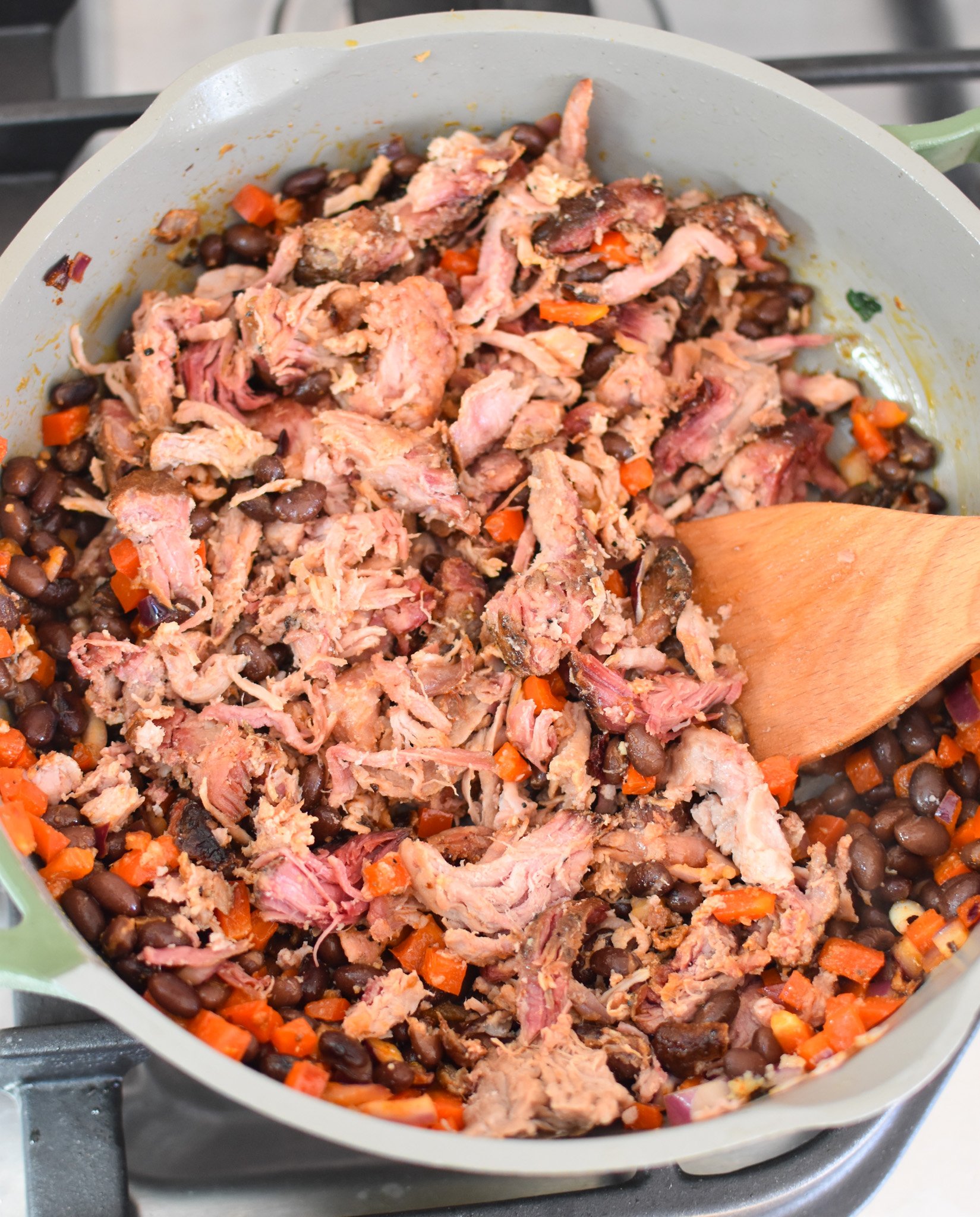 Pulled Pork Burritos with beans and diced red peppers 