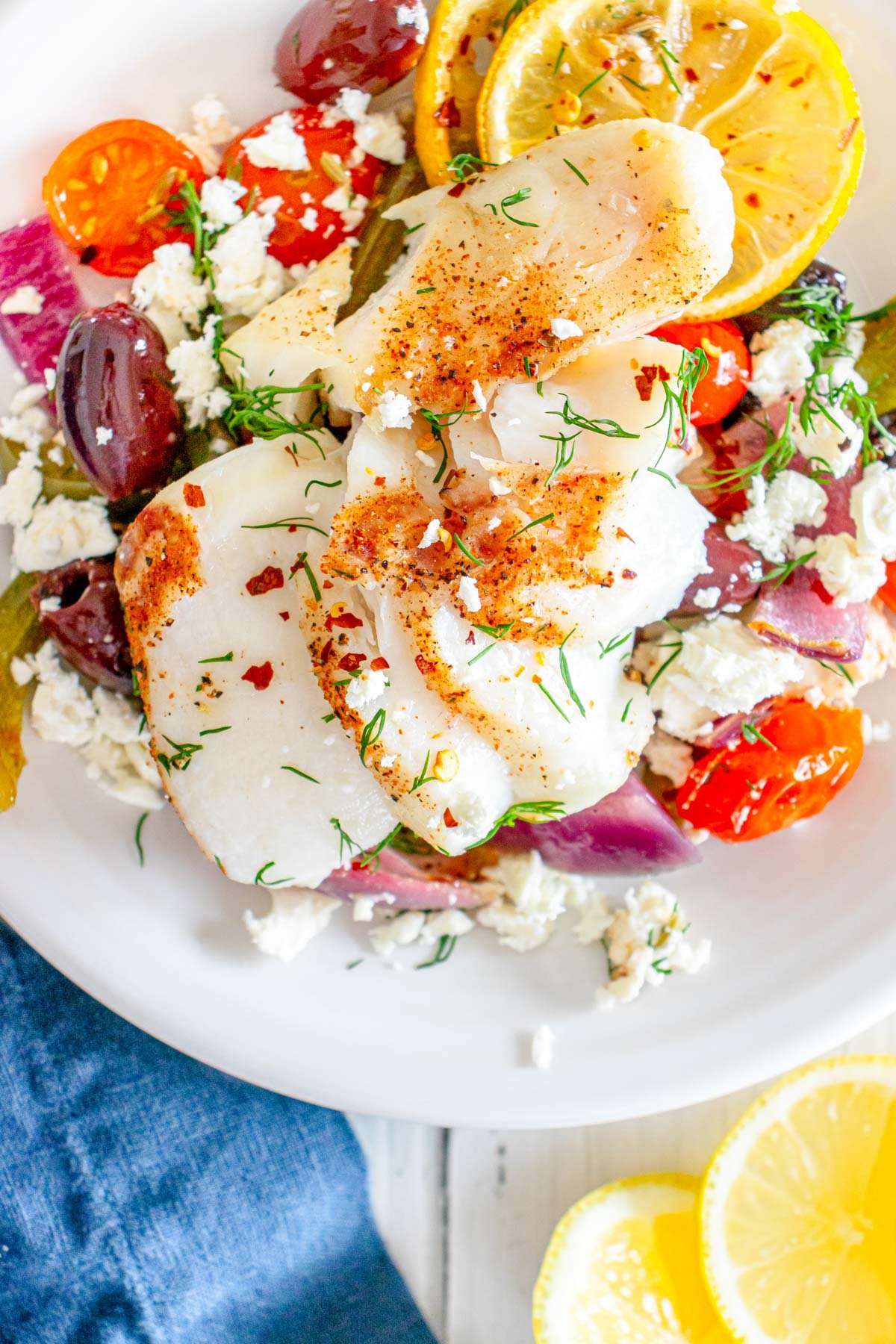 Sheet Pan Mediterranean Cod in a white bowl