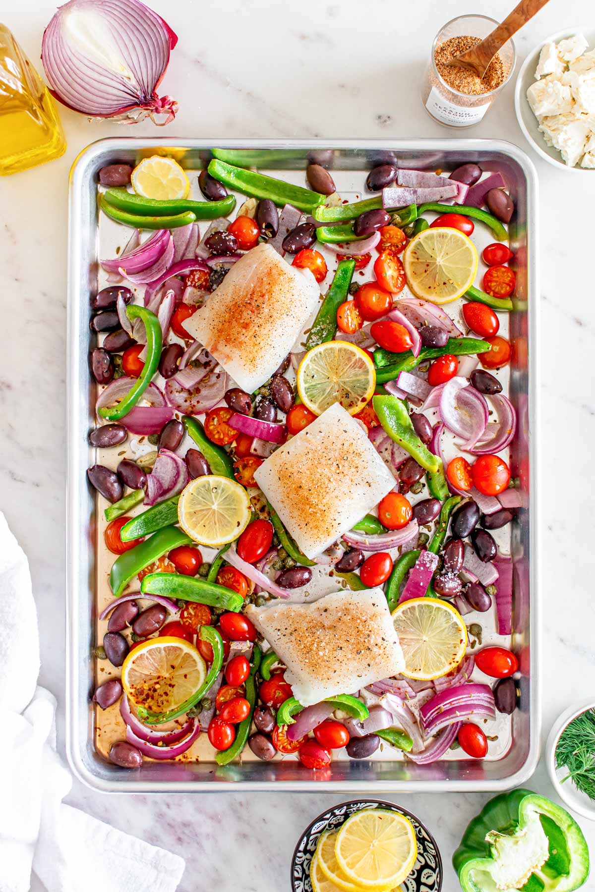 Sheet Pan Mediterranean Cod with fish on a sheet pan 