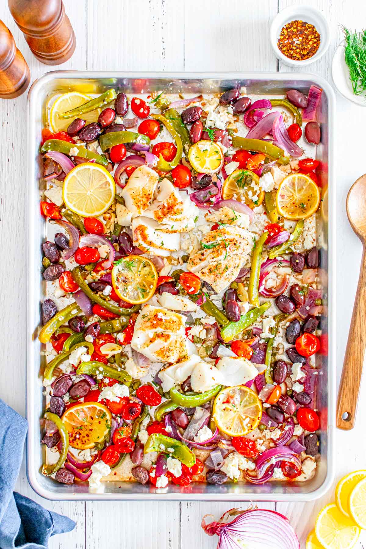 Sheet Pan Mediterranean Cod on sheet pan with spoon