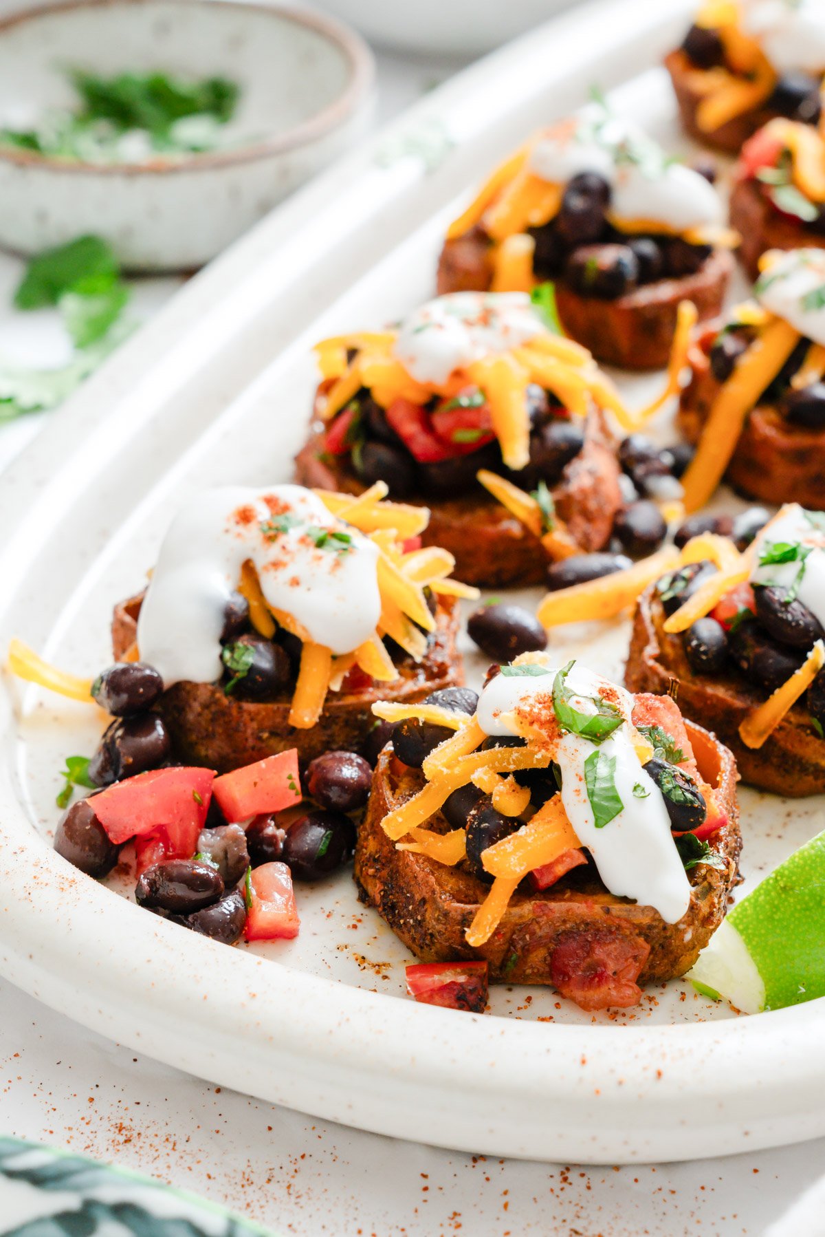 Southwestern Roasted Sweet Potato Rounds on white platter