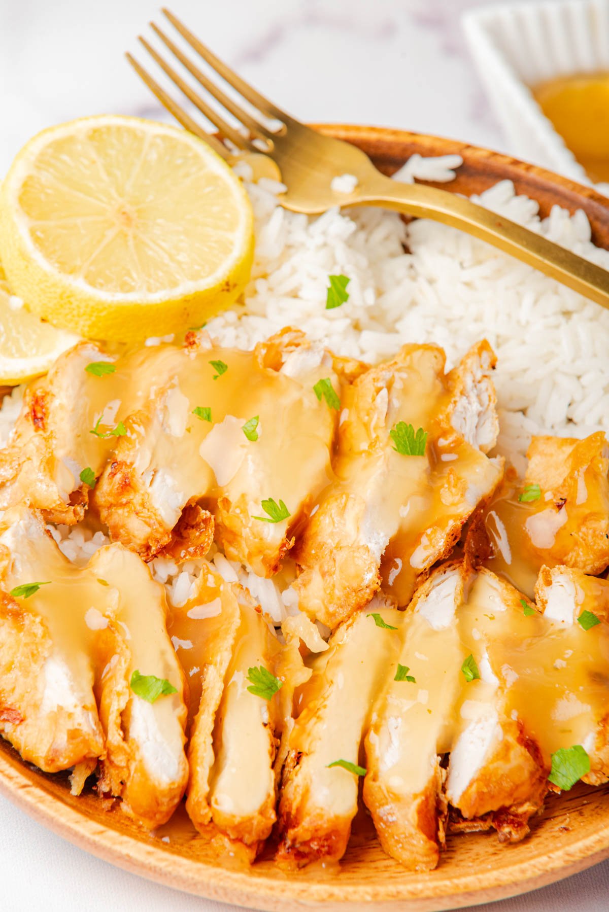 Air Fryer Chicken Breast over white rice with fork
