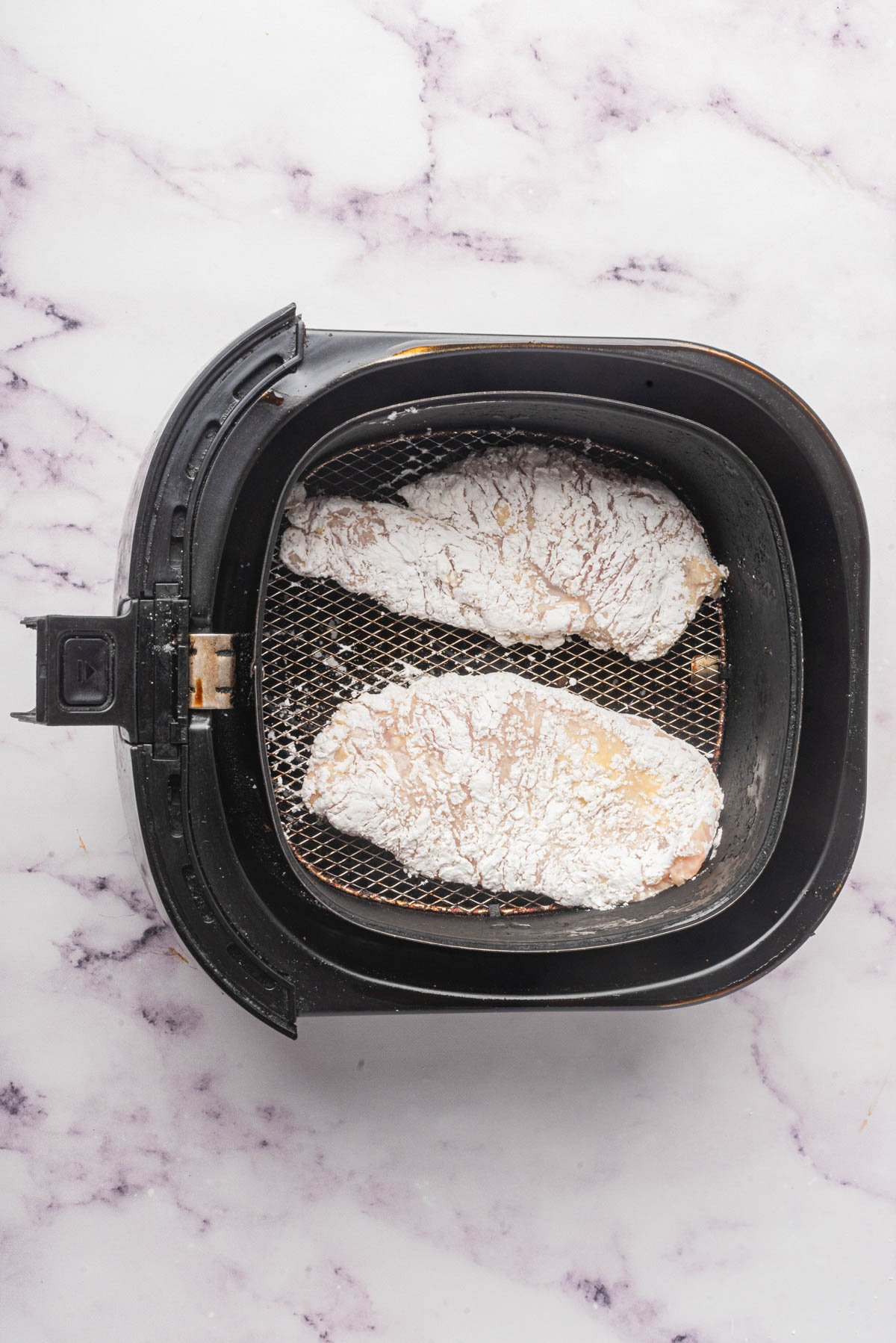 Air Fryer Chicken Breast in an air fryer basket