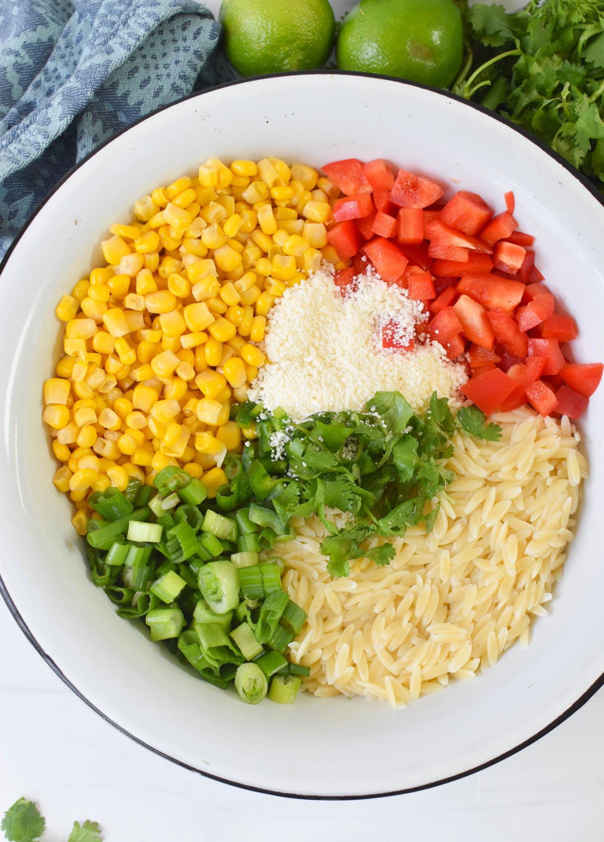 Mexican Street Corn Orzo Pasta Salad ingredients in a bowl