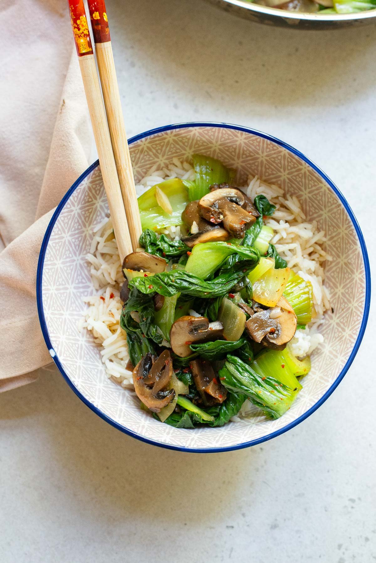 Bok Choy Stir Fry in a bowl with chopsticks. 