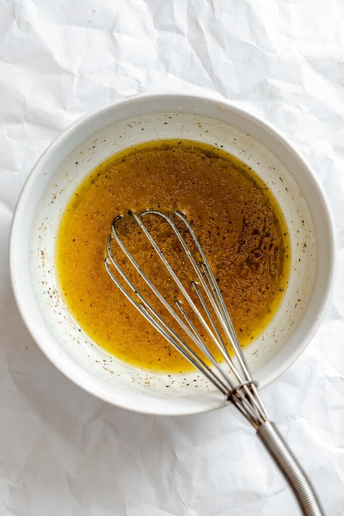 Summer Orzo Pasta Salad dressing ingredients mixed in bowl 