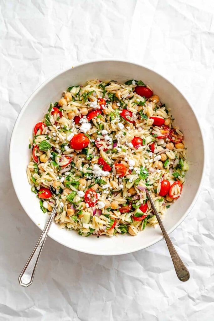 Summer Orzo Pasta Salad ingredients mixed in bowl 