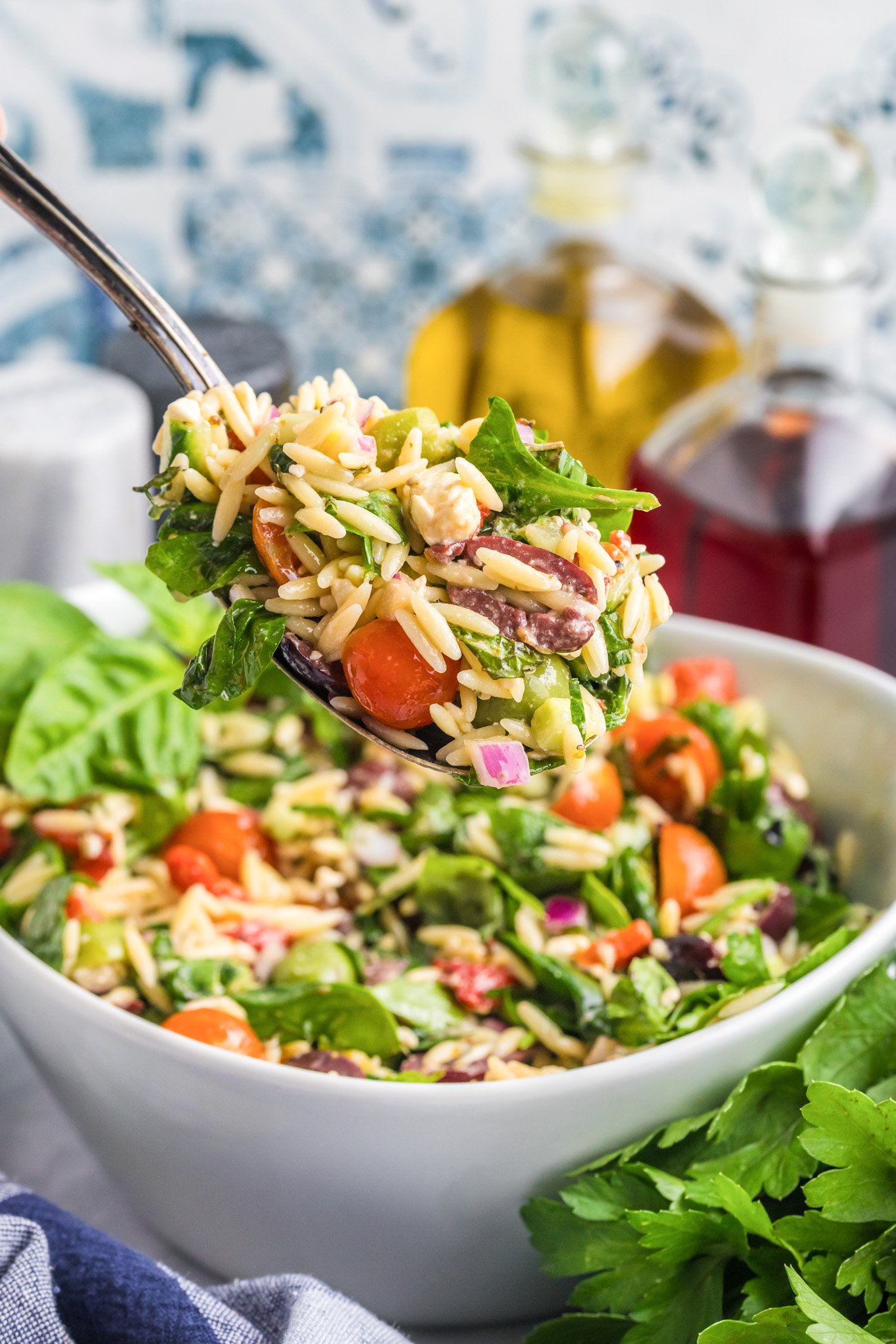 Mediterranean Pasta Salad with large spoon 