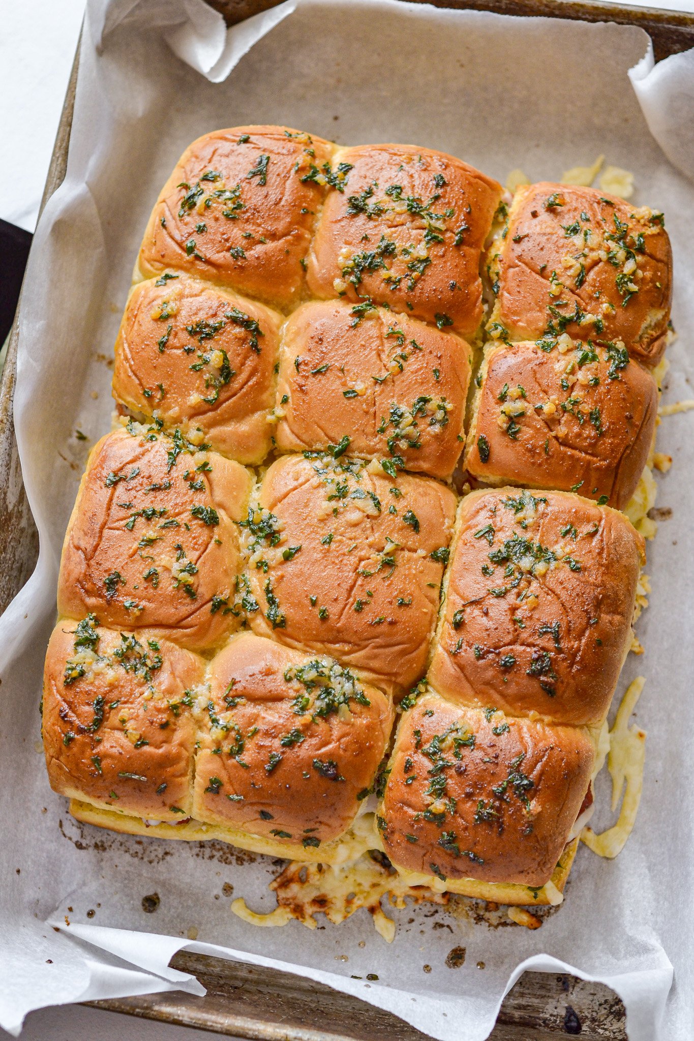 Easy Chicken Parmesan Sliders on parchment paper 