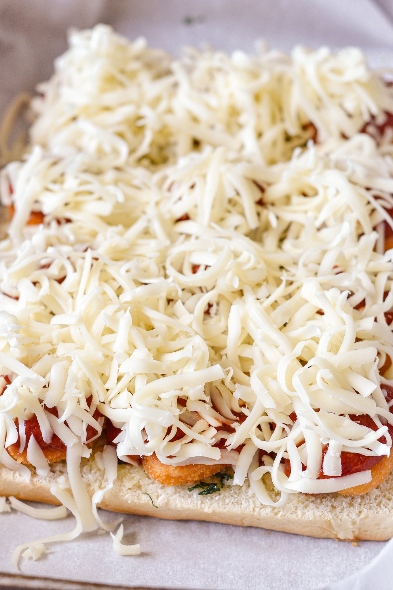 Easy Chicken Parmesan Sliders adding cheese