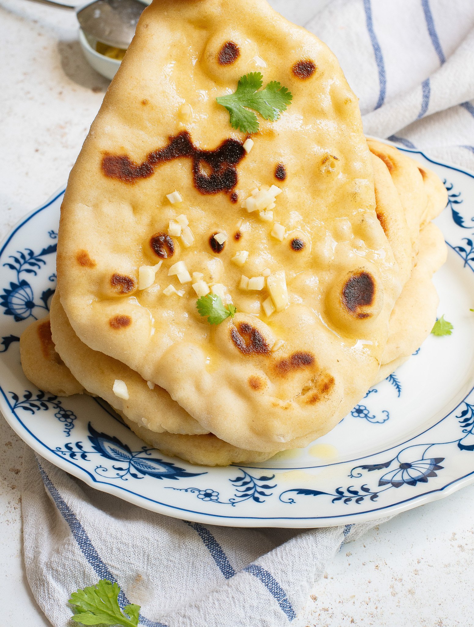 Easy Homemade Naan holding it up