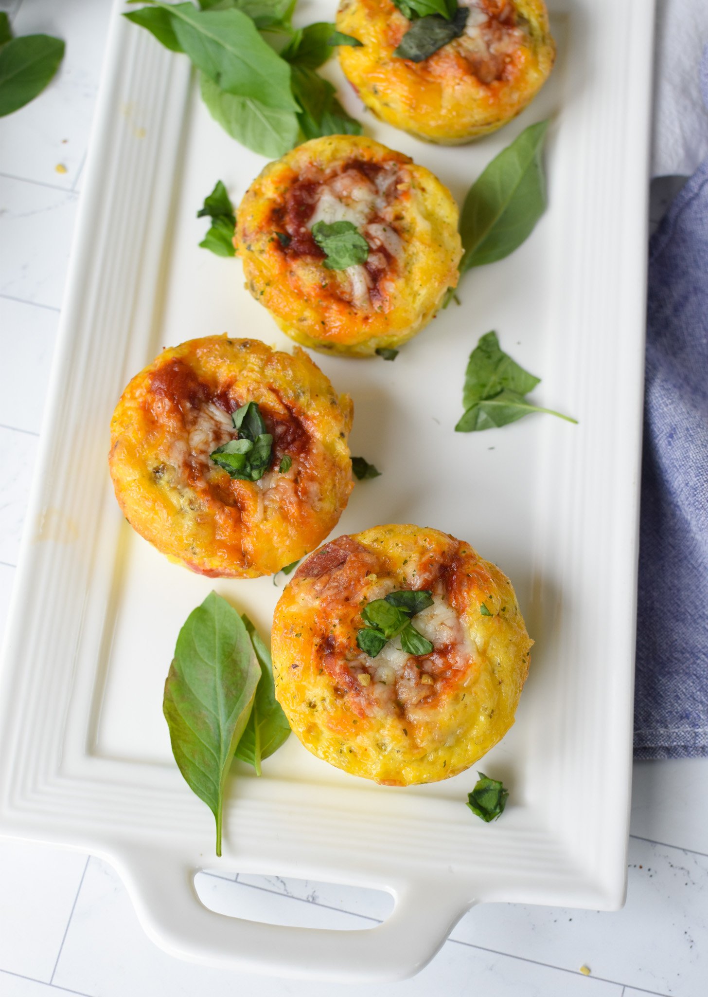 Pizza Egg Muffins on a white platter