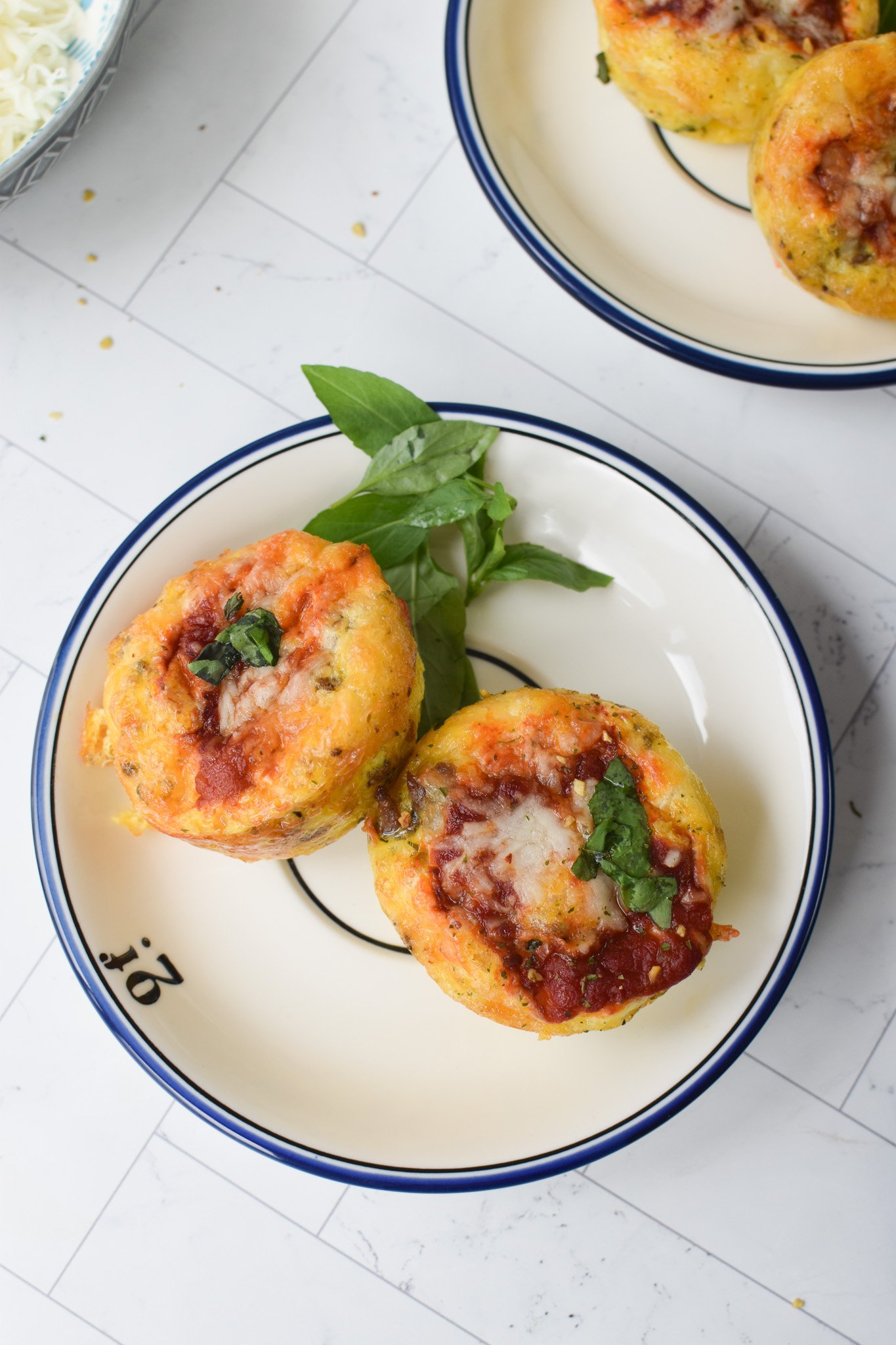 Pizza Egg Muffins on a round plate