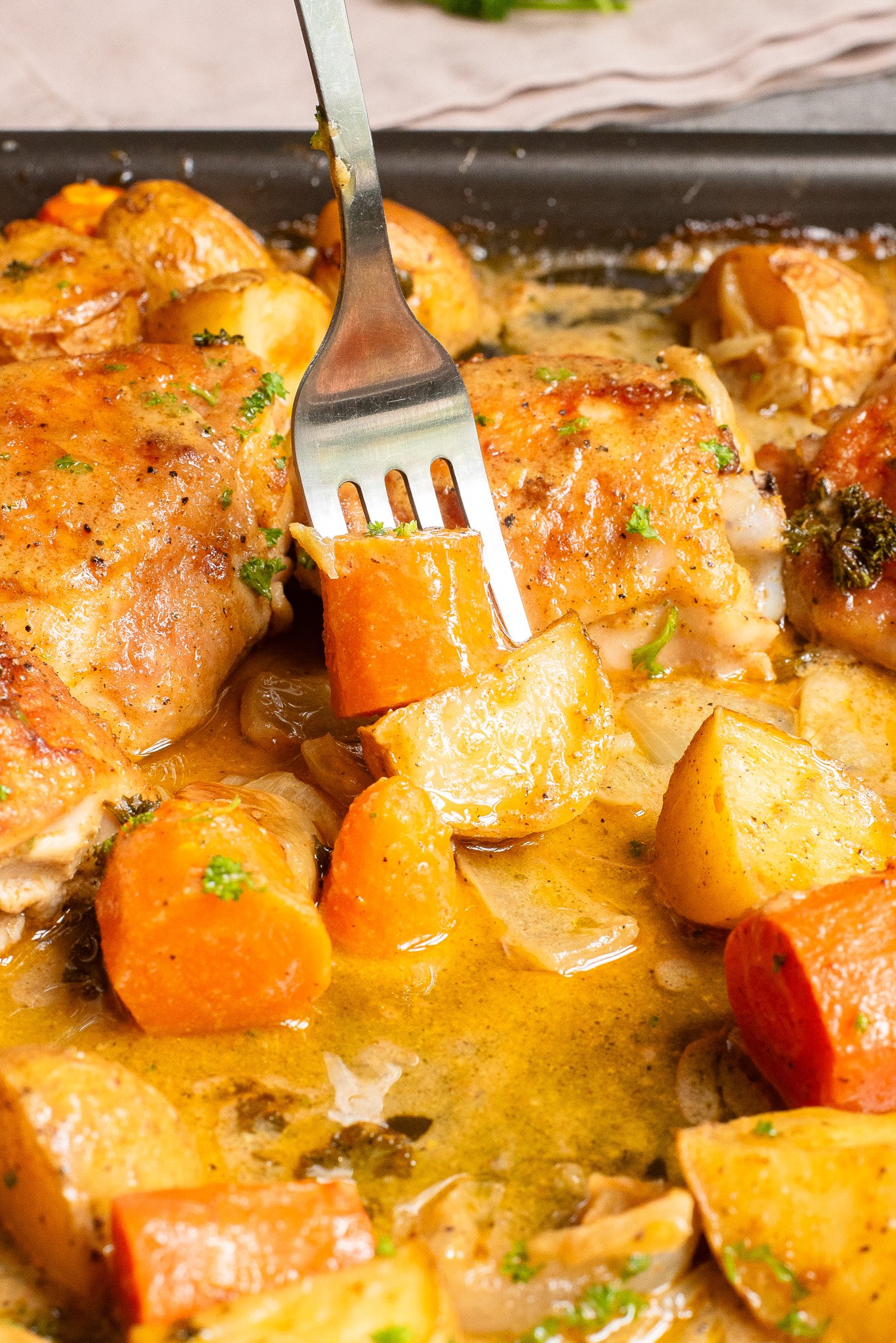 Sheet Pan Honey Mustard Chicken Thighs with fork