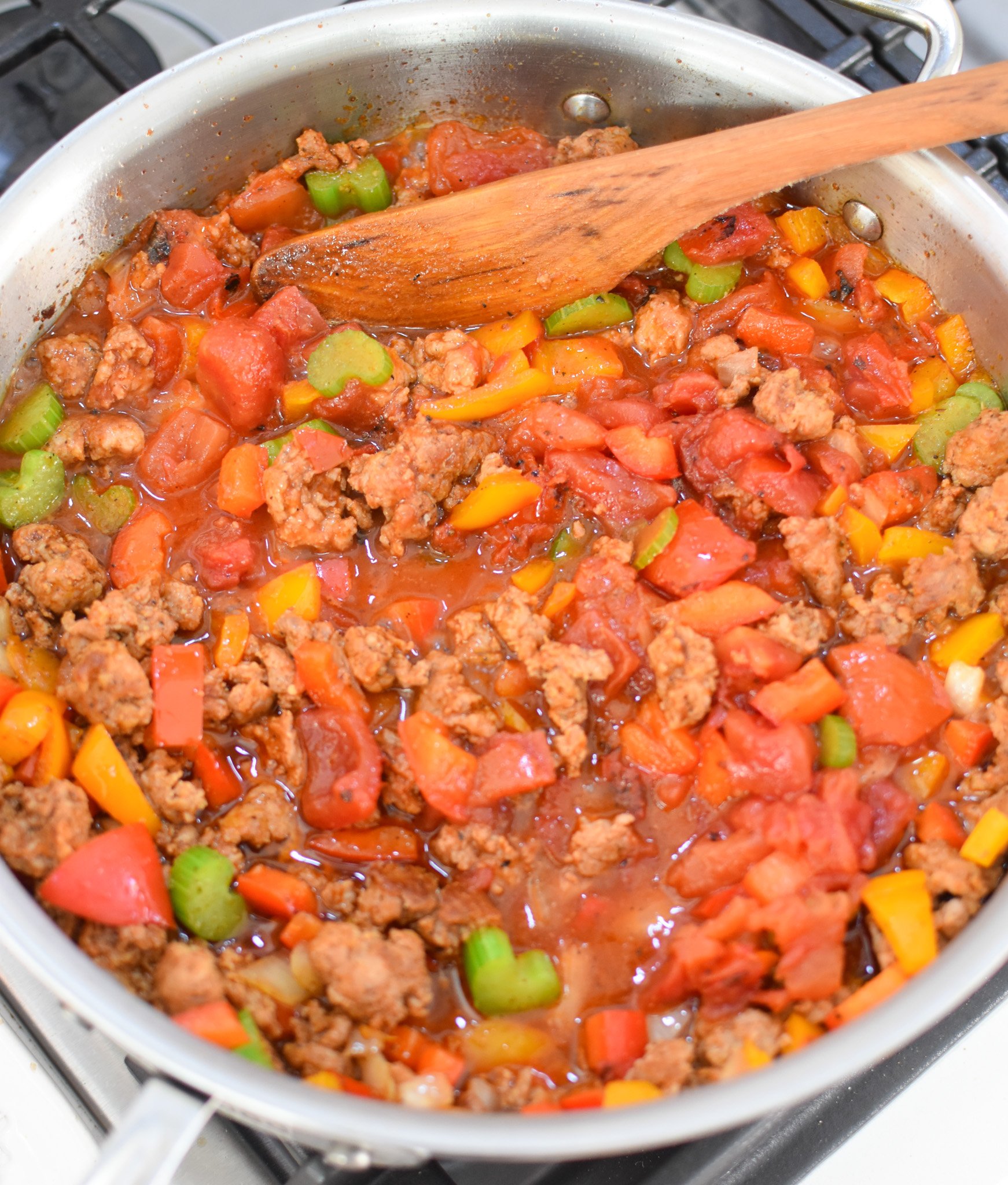 Creamy Cajun Sausage Rice Skillet with tomatoes in a skillet 