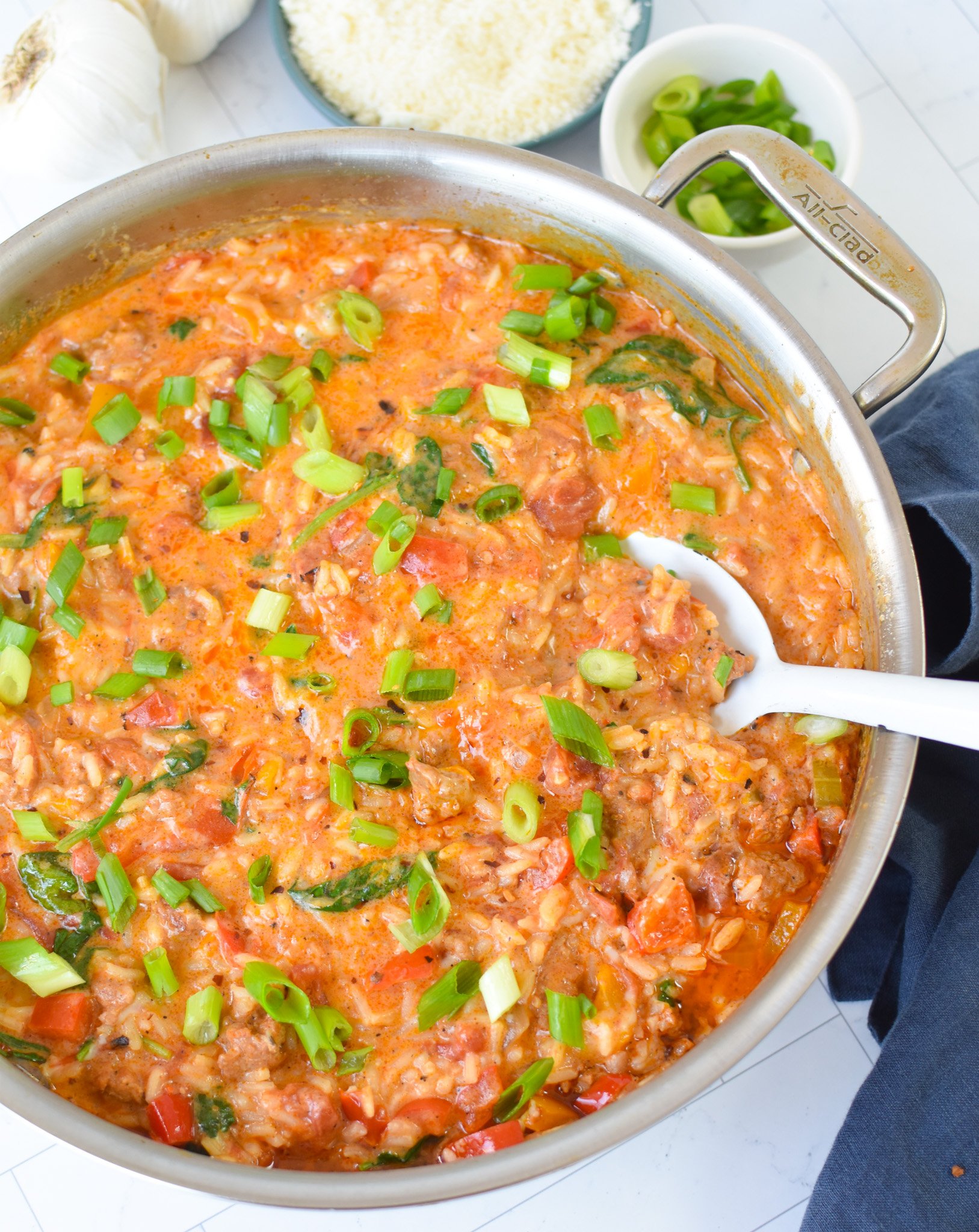 Creamy Cajun Sausage Rice Skillet with spoon 