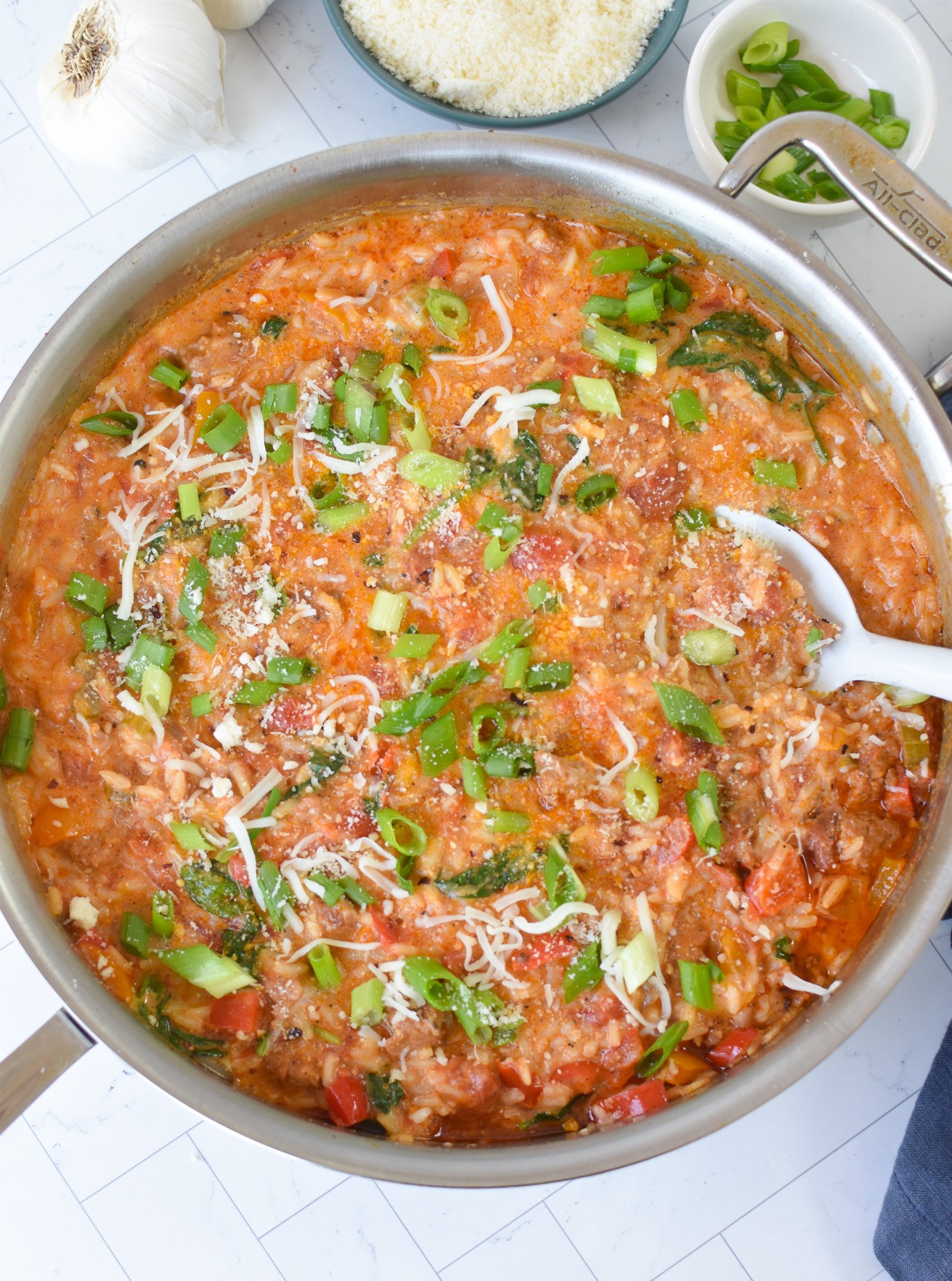 Creamy Cajun Sausage Rice Skillet with cream in it 