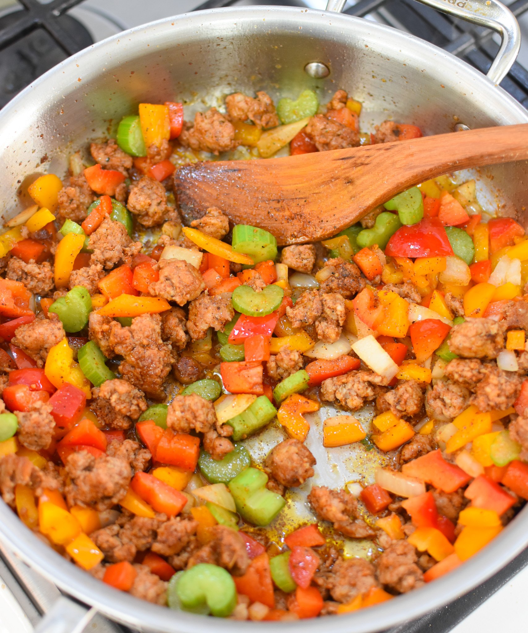 Creamy Cajun Sausage Rice Skillet sausage and vegetables in a skillet 